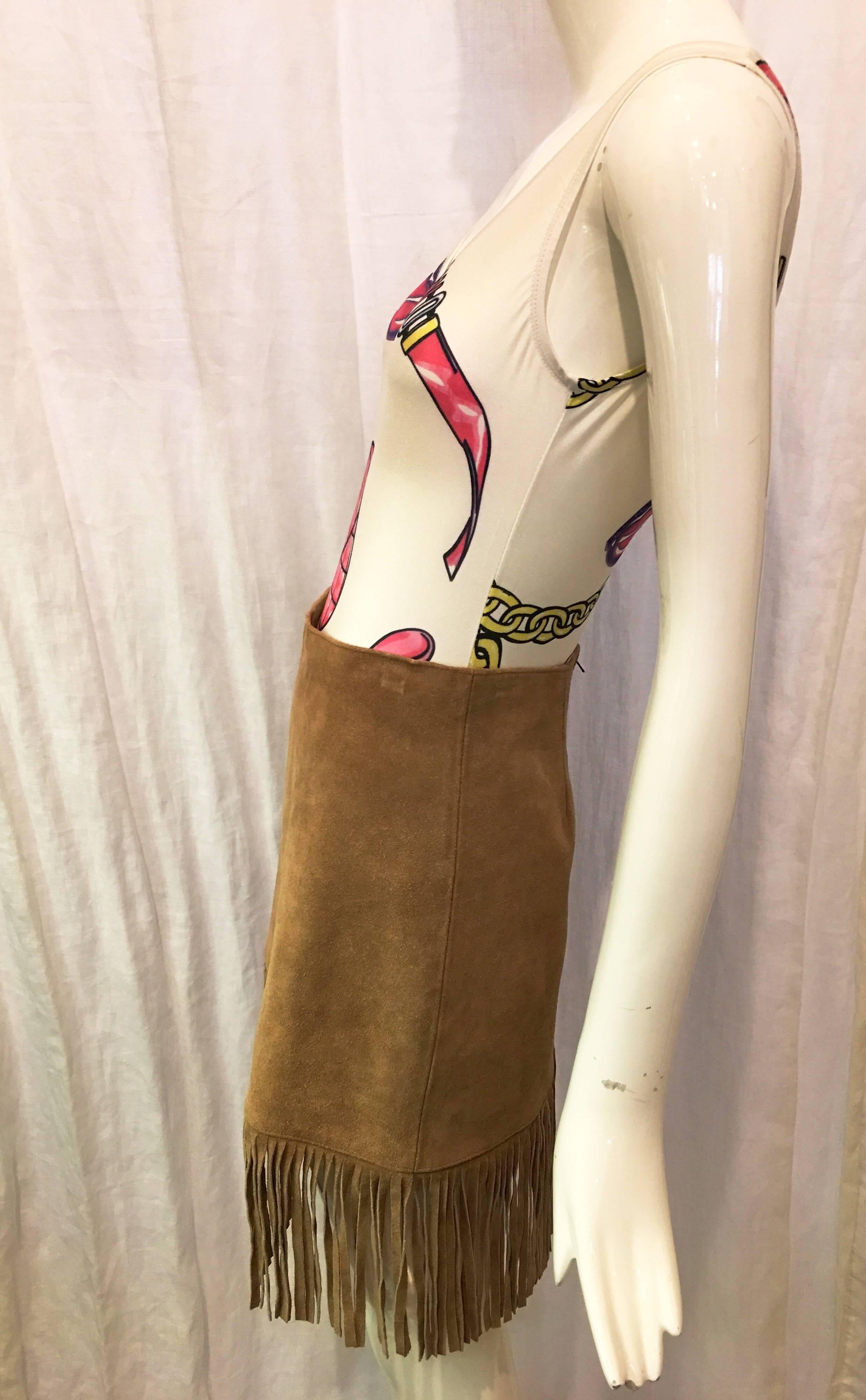 Tan suede straight skirt with fringe trim. Trim is 7