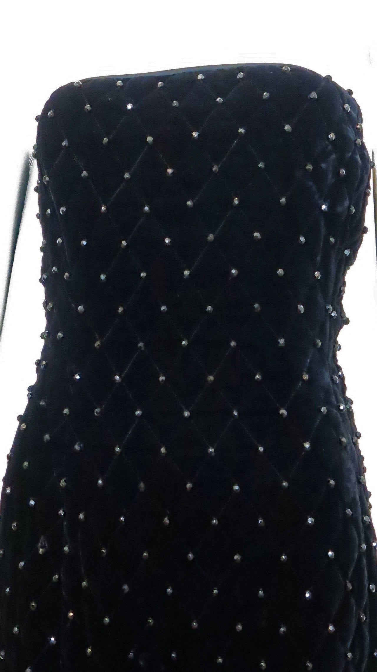 This soft and stunning quilted black velvet mini dress hugs the body and is covered with multifaceted black beads. 

Size: US 8

*Please contact dealer prior to purchase for white glove shipping options*