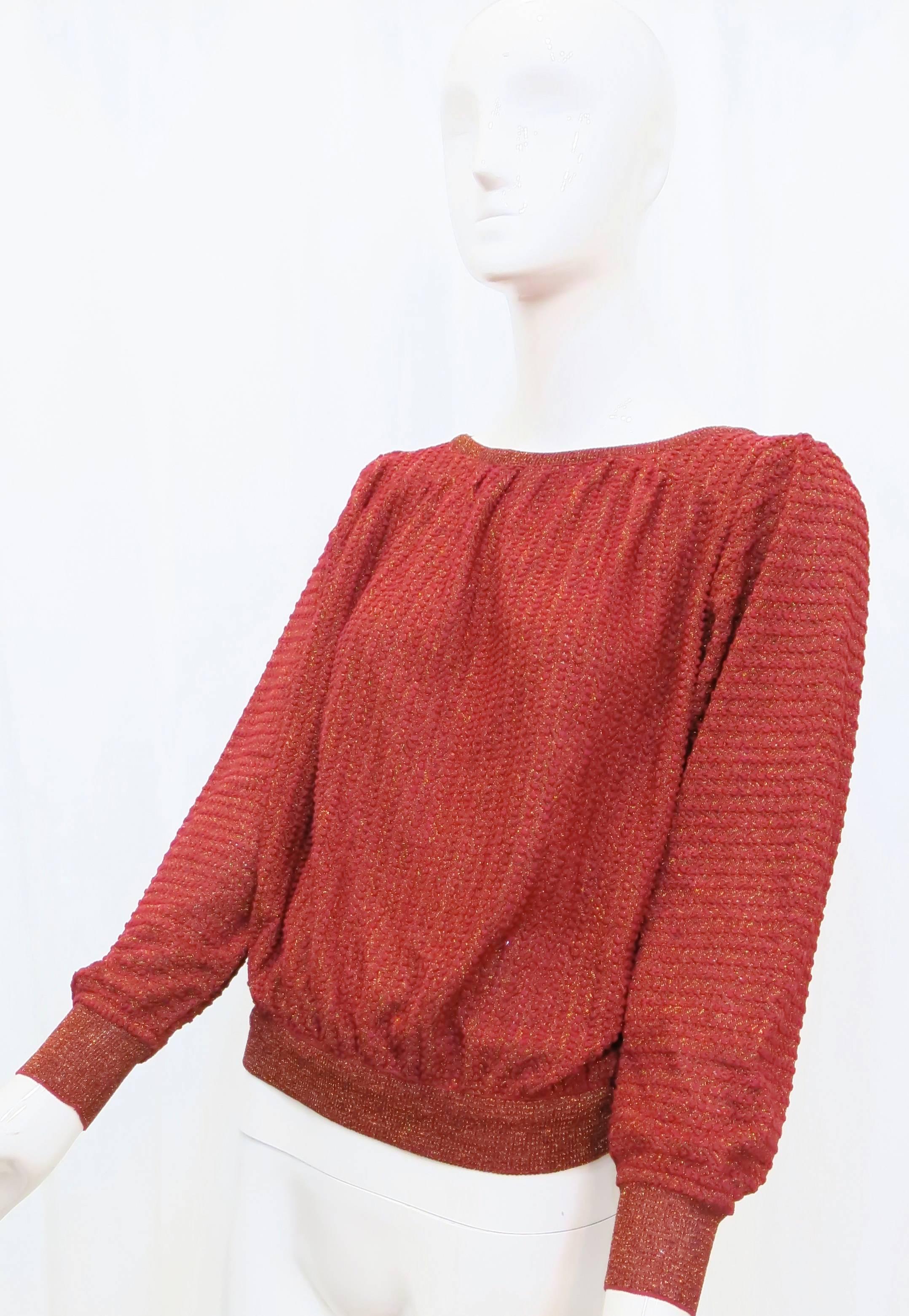This red, shimmering sweater from Missoni can go from day to night, with ribbed sleeves, puckered shoulders and a voluminous body that pulls in to a fitted waist. Made in Italy.

Size marked: M

*Please contact dealer prior to purchase for white