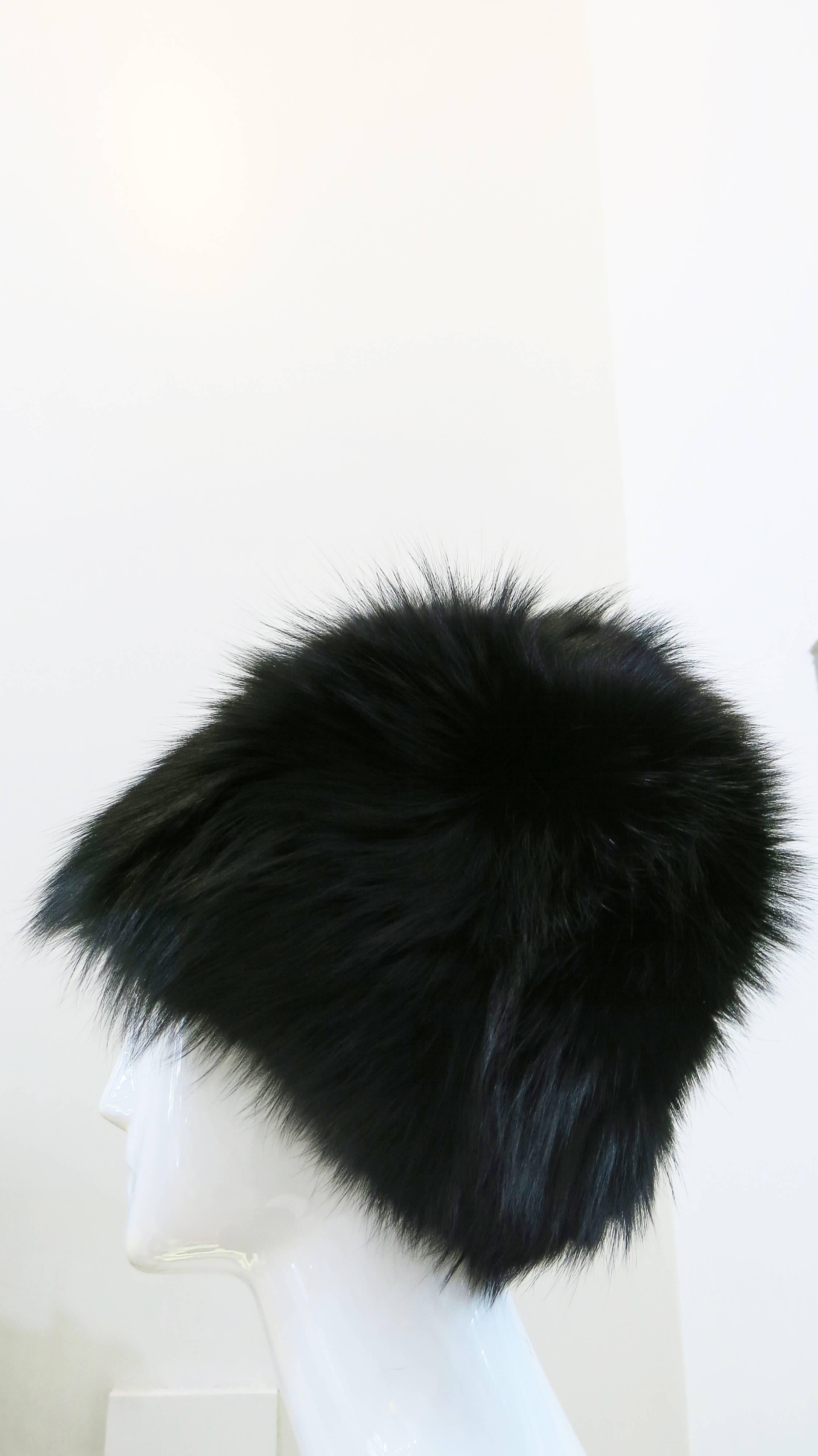 Fully lined black fox fur hats from Saks Fifth Avenue circa the 1970's. Beautiful, soft, and in impeccable condition. This hat is definitely on the larger side, so please pay attention to the measurements included below. Lining and stitching on the