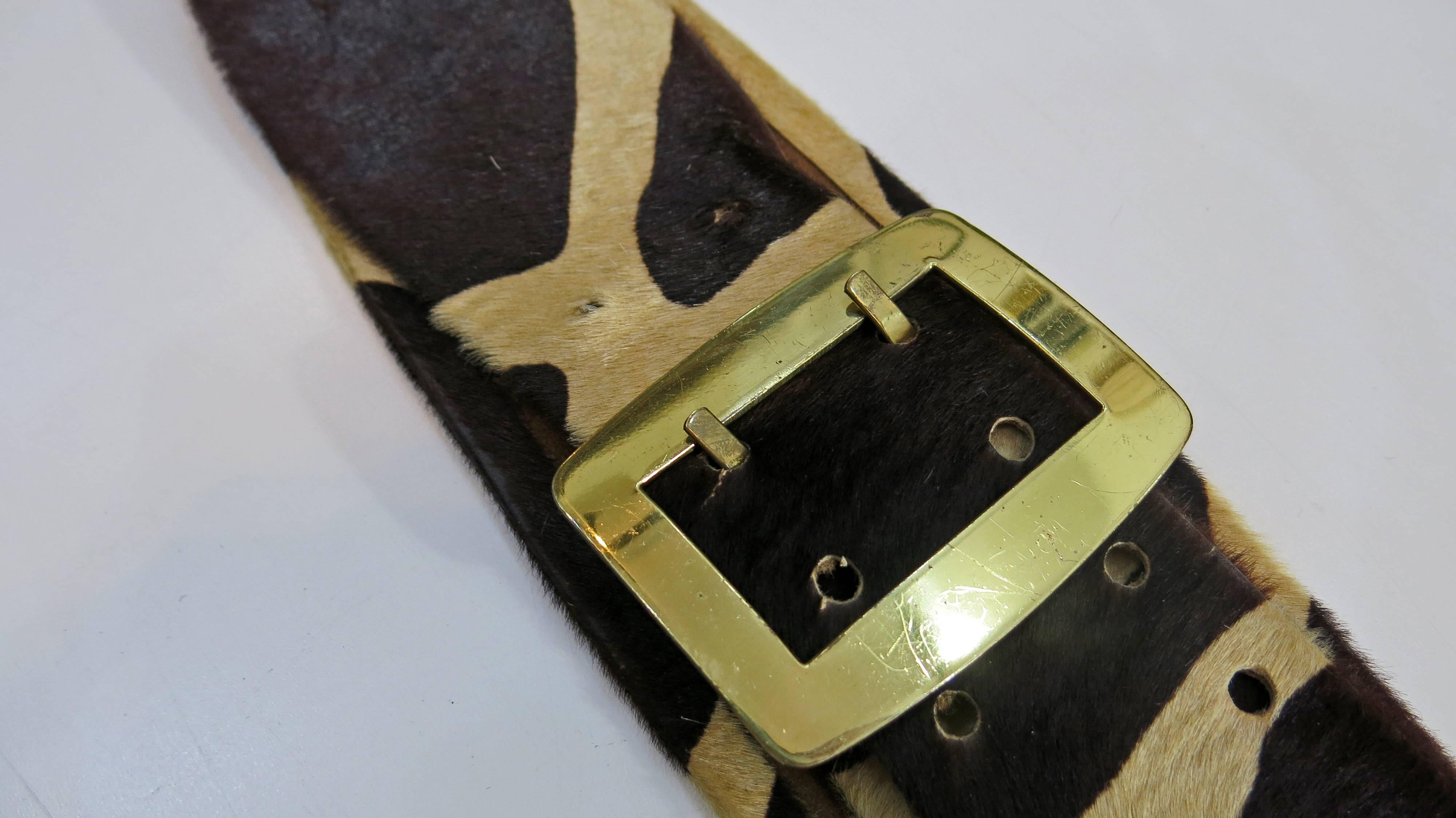 Beautiful and unique pony hair belt with gold tone buckle and circular gold tone links. Dark brown and tan spotted pattern. 4 sets of holes for adjusting the width of the belt as well as one set which was hand punched by the previous owner. Buckle