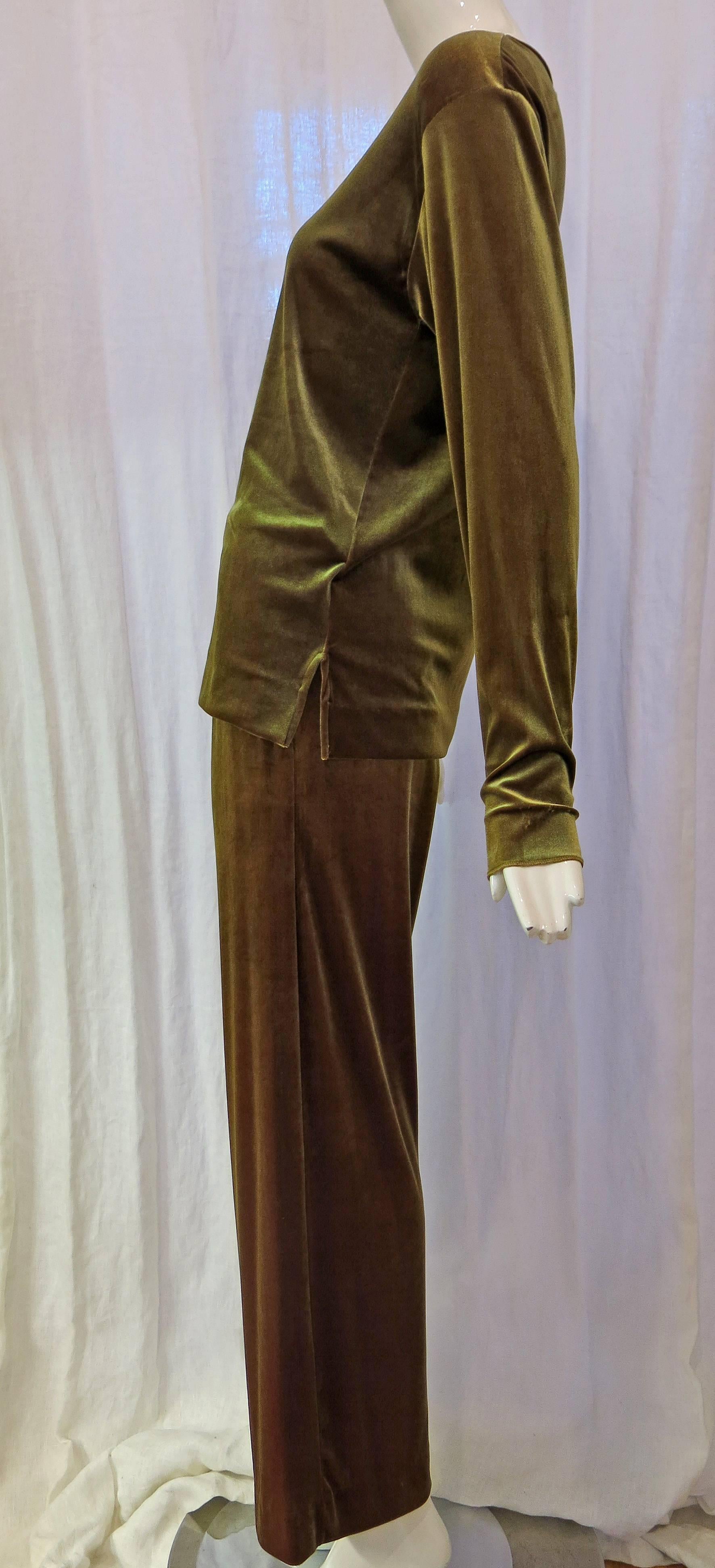 Matching iridescent green velvet top and bottom set from Joan Vass. Could be worn to relax at home or for a casual shopping day. Catches the light beautifully. Very comfy yet chic! Pants have pockets!

Joan Vass began as an editor of art books. She