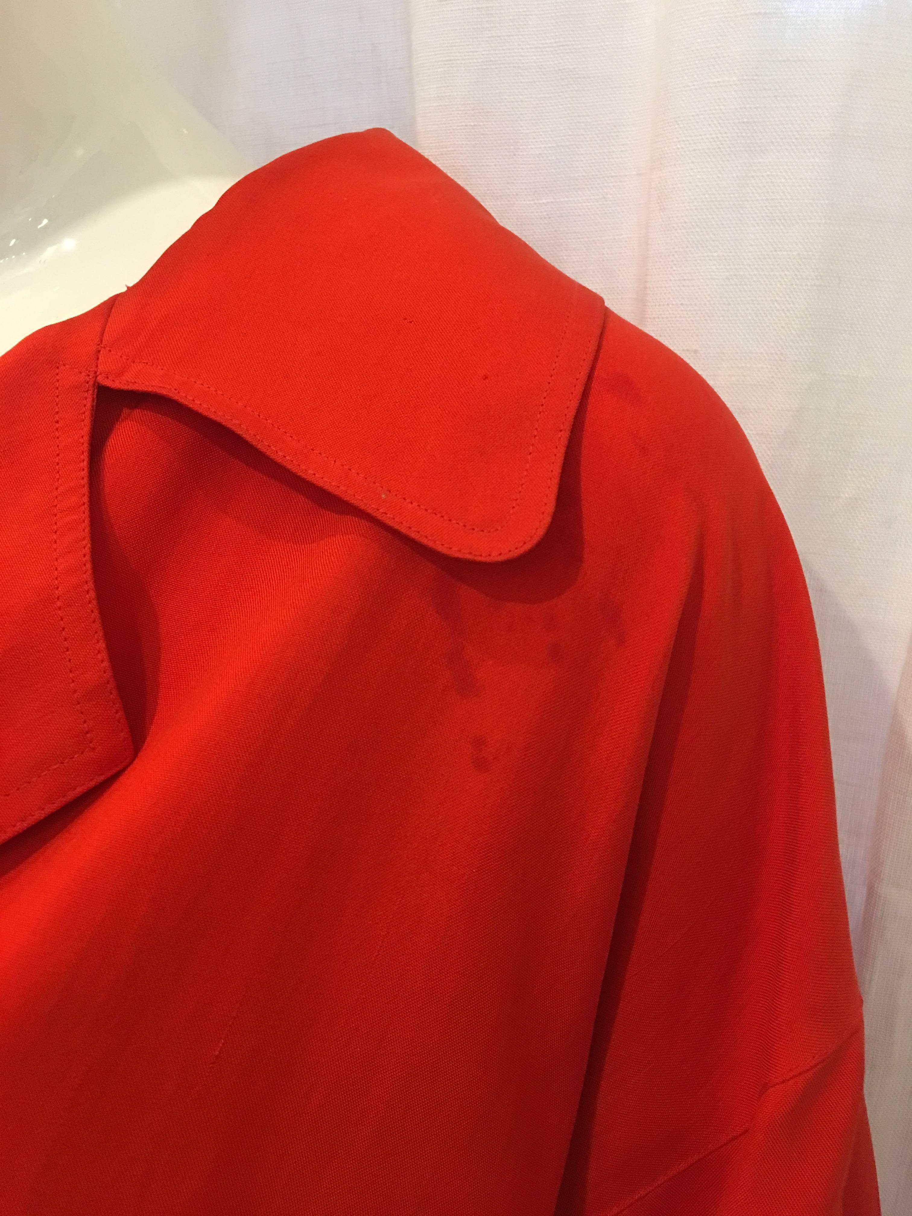 Beautiful red silk lightweight jacket. Double breasted style. Eye-catching yet simple. Perfect for spring weather or a layer during colder weather. Perfect vibrant shade of red. Some staining, please note photos.