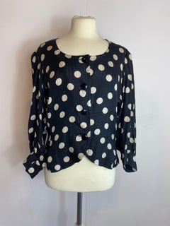 Chemise à pois noirs Yves Saint Laurent.
