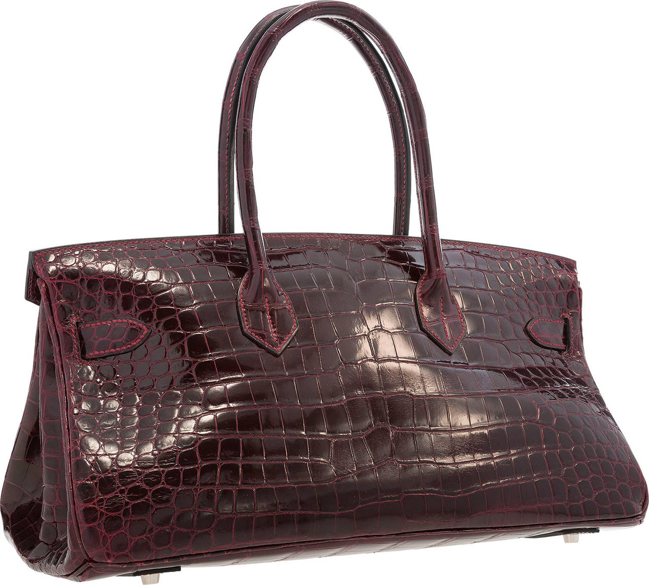 Designed by Jean Paul Gaultier, this lower, elongated version of the classic Birkin was designed to fit on the shoulder.  This bag is very rarely seen in exotics, making this Shoulder Birkin a fantastic collector's item.  The exterior is Shiny