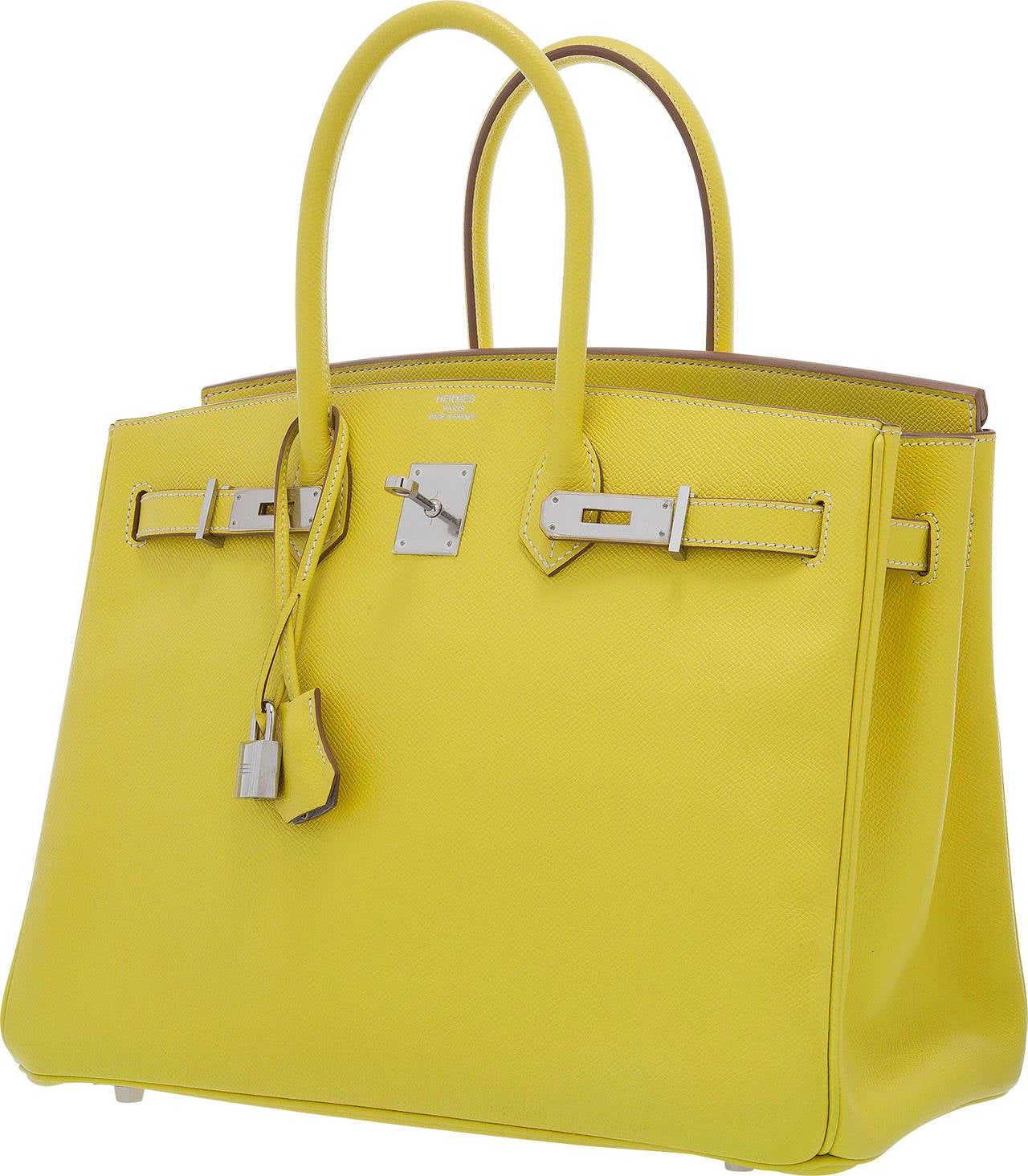 Add a pop of color to your look with this Birkin. The Hermes Candy Collection is known for using two colors in the construction of bags. The exterior of this bag is done in a bright Lime Epsom Leather while the interior is done in Gris Perle Chevre