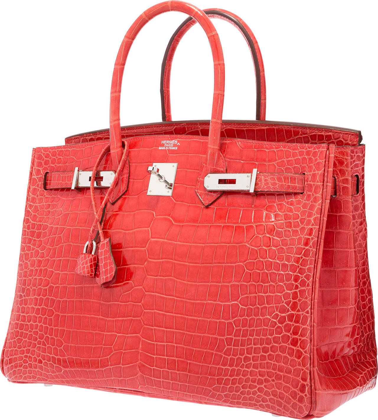 This Birkin makes the perfect bright accessory! This collectible, hard to find bag is done in a fun and vibrant color but manages to maintain an elegant allure. It is done in Shiny Bougainvillea Porosus Crocodile, an unbeatable combination.  This