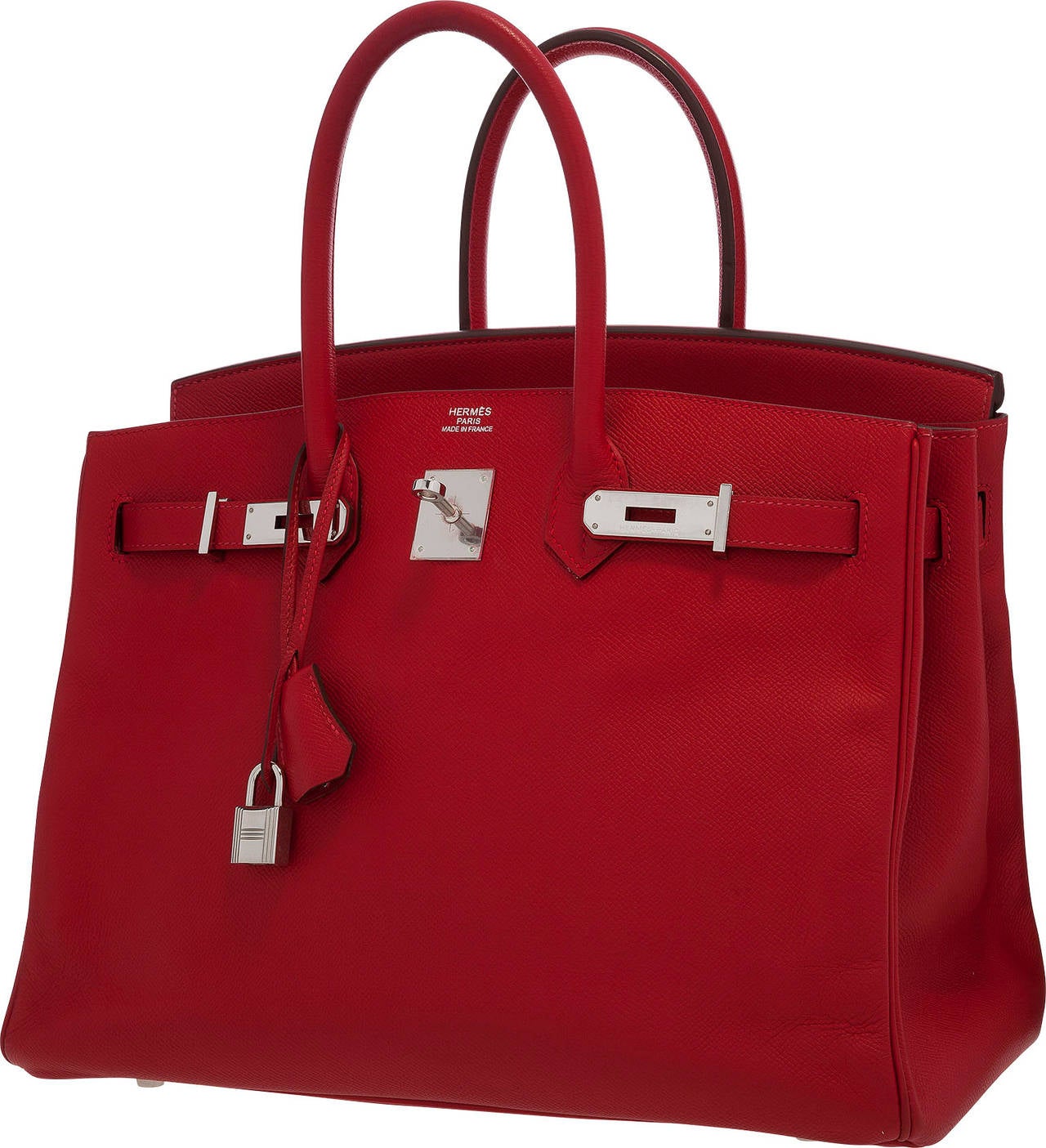 This classic Birkin Bag, done in a bright and fiery red coloration, is the perfect way to add a fun elegant piece to any wardrobe. Done in Rouge Casaque Epsom Leather, this bag will not blend into the droll. This bag features Palladium Hardware, two
