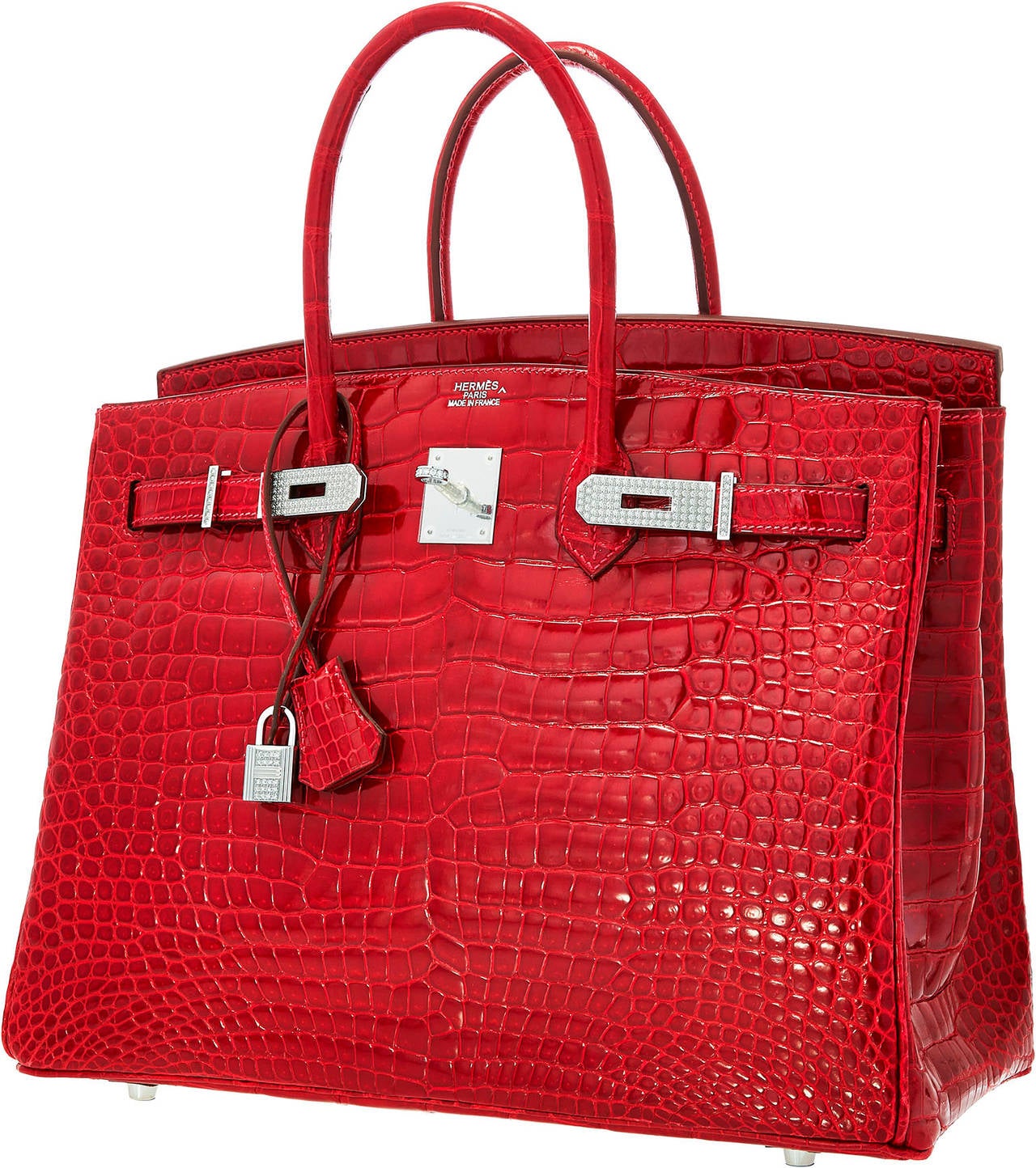 A 35cm Diamond Crocodile Birkin is possibly most desirable handbag in the world. This bag is done in Braise Porosus Crocodile, one of Hermes' most luxurious exotics. The coloration is paired perfectly with 18K White Gold Hardware, which is studded