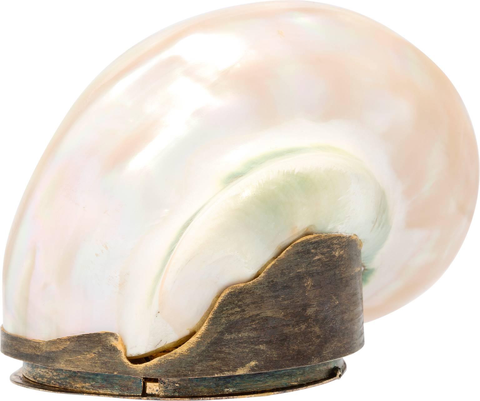 Take the serenity of the beach with you to elegant evening events with this simply gorgeous minaudiere by Judith Leiber. It is not often that a Judith Leiber minaudiere comes in seashell, so this minaudiere is a spectacular opportunity to own an