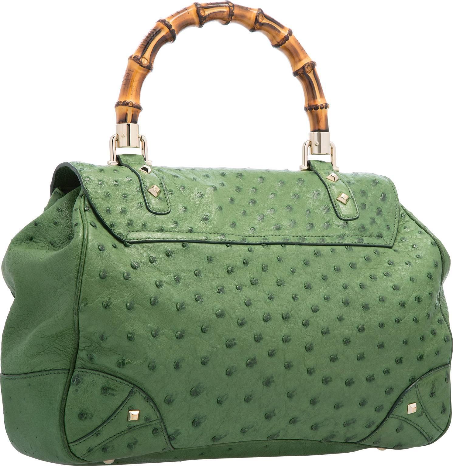 A fabulously luxurious Gucci bag, this iconic look is so highly recognizable and sought after. This bag is done in green ostrich, featuring one bamboo top handle, and a flap top with a bamboo turnlock closure. The interior is done in green suede,