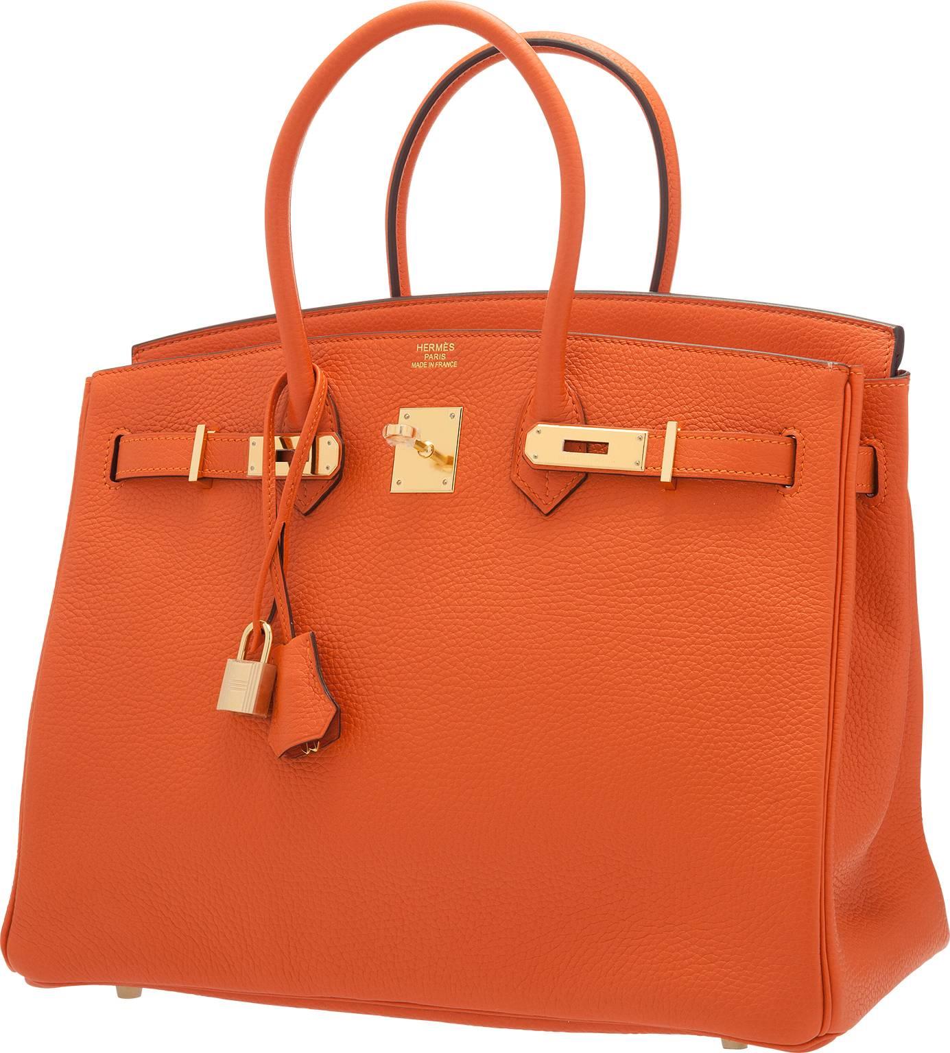 The Birkin bag is one of the most recognizable and sought after handbags in the world. This particular Feu Clemence Leather Birkin will add a wonderful pop of color to your wardrobe. This bag features two leather handles, lock, keys, and clochette.