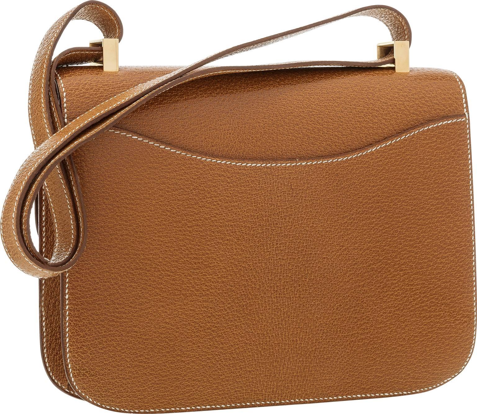 The Constance is the ultimate day to night bag. This particular Constance is a collector's item for being in such good condition and being done in a rare material! Done in Natural Peau Porc featuring Gold Hardware, this bag is very unique. This bag