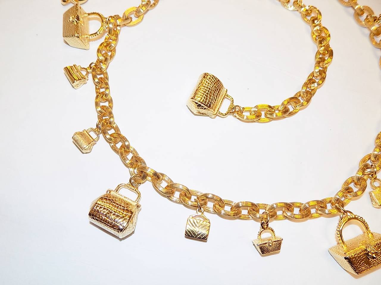 Spectacular vintage Judith Leiber  Miniadeure Bags   Charms Belt  . Gold tone chain with hanging small bags in different design. Some of them look like crystal bags and some like exotic skin bags but all represent distinguished Judith Leiber