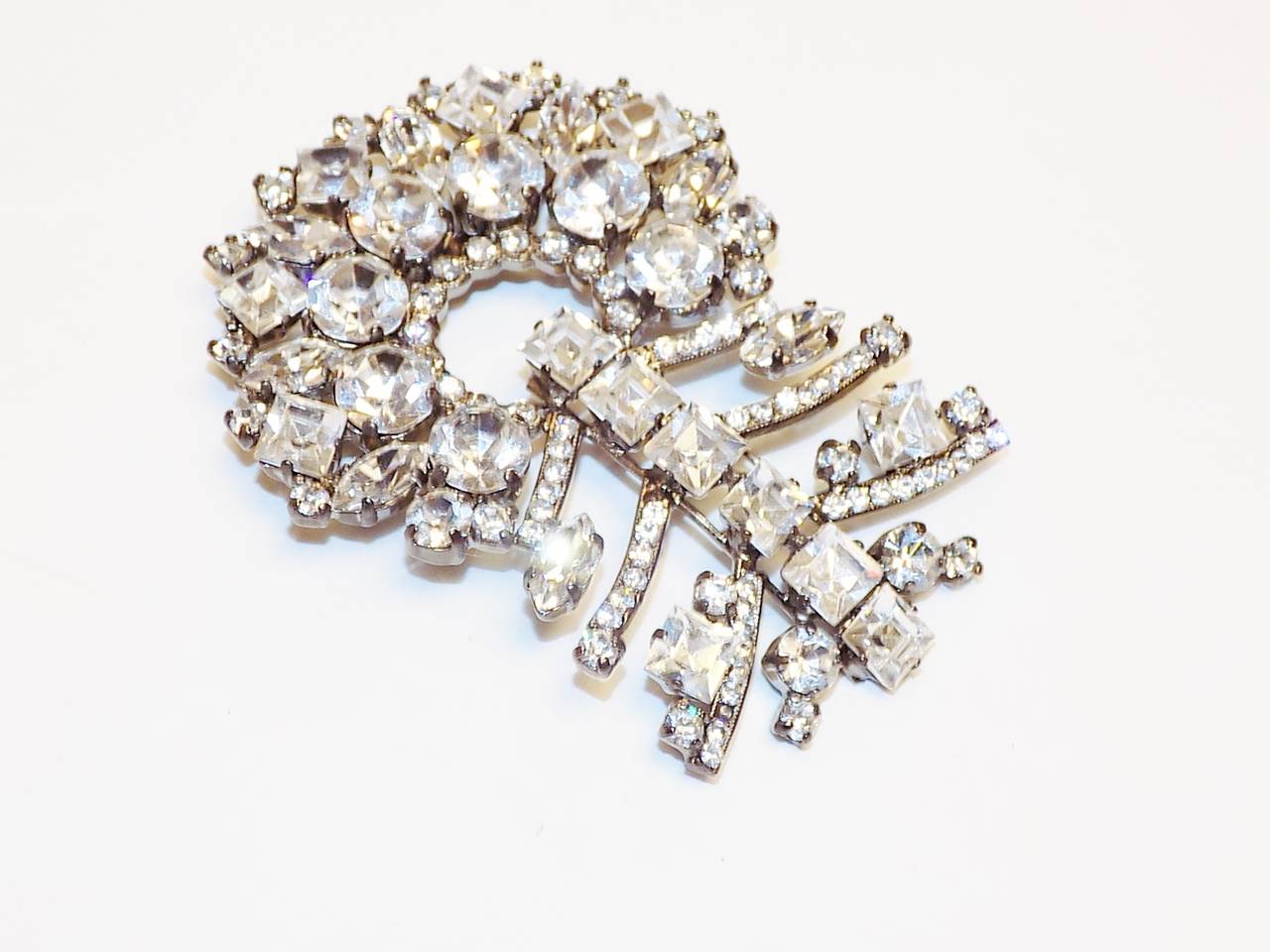 Early Armani hand set with crystal large pin. Stones sparkle like real diamonds. 
Beautiful design. . Brooch is 3 inches long and 2 inches wide