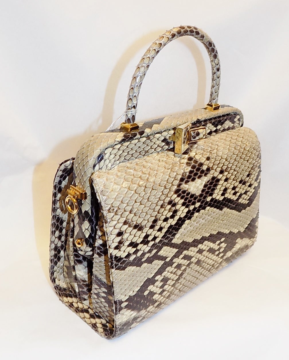 Never used spectacular Judith Leiber hard case  Python Skin bag. Gold tone frame. 40