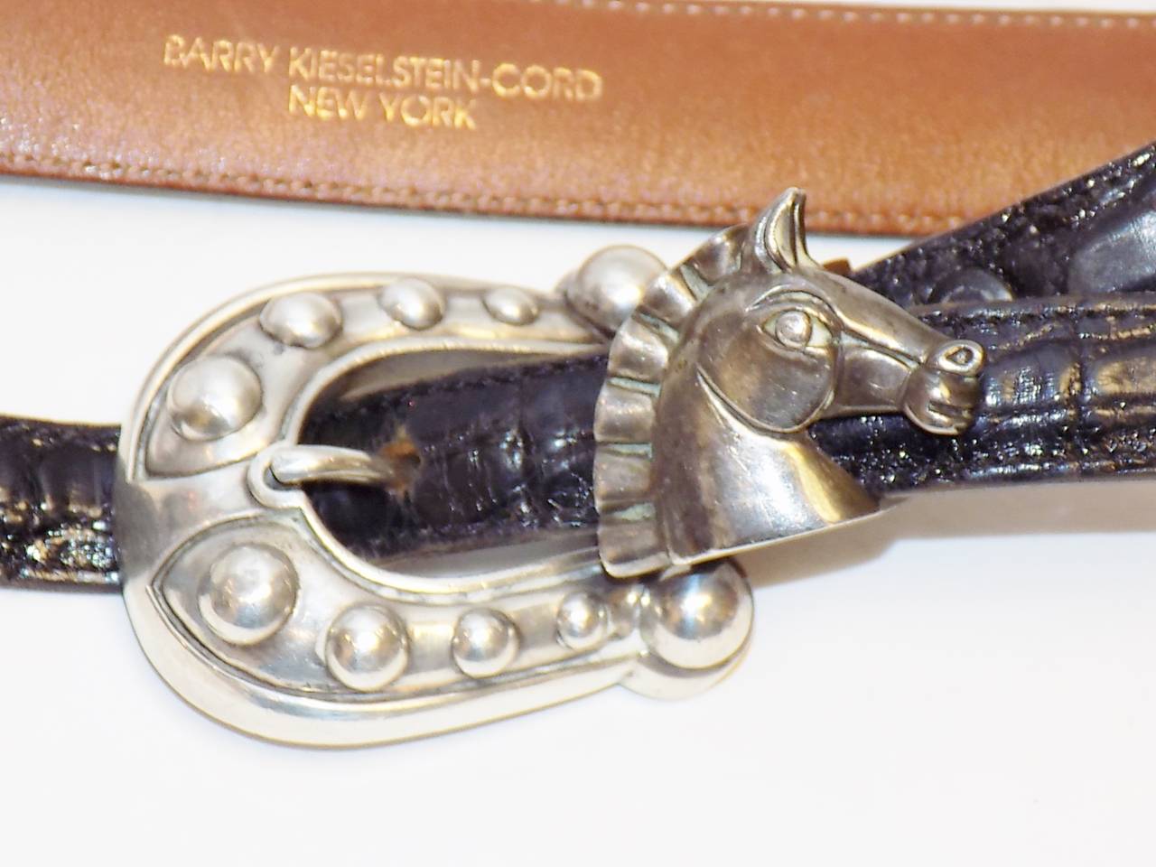 Very beautiful unisex  Barry Kieselstein Cord Sterling Silver  Horse Head belt buckle; adjustable size Large belt, measures appox. 42 long with holes at Last hole at 36 inches. Buckle measures 2.13