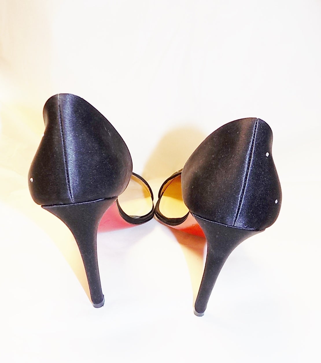 Beautiful Christian Louboutin black silk pumps with swarovski crystals. Pointy toe. Worn only once  on the carpet.In pristine condition . sz 37. Heel 4