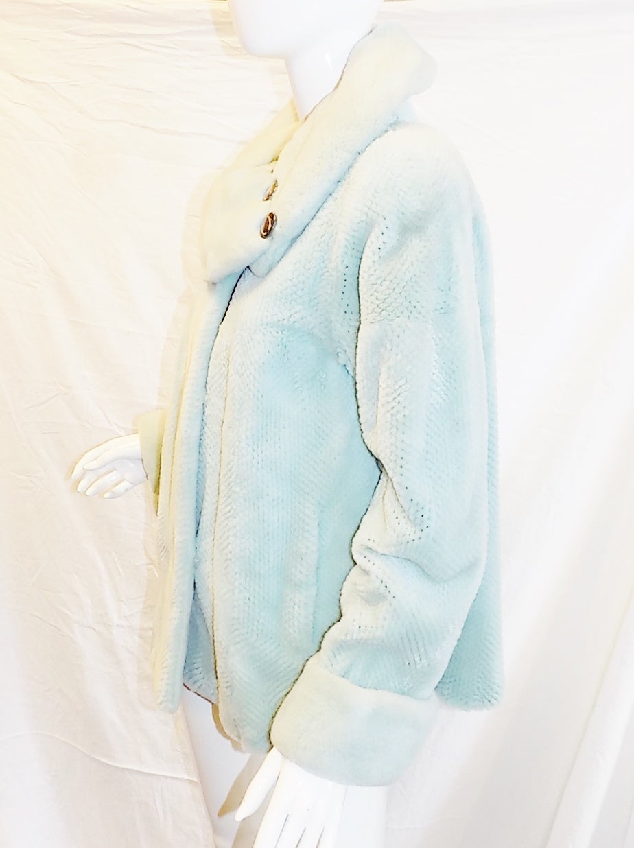 Showing  his ability to innovate techniques this brilliant design of lite blue dyed and sheared mink jacket is a must in your closet for transitional weather or mild winters or for just 