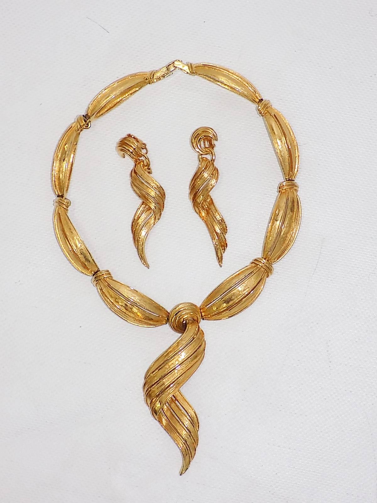 Vintage Boucher  massive  gold  choker necklace and drop earrings.
 Boucher apprenticed at Cartier’s as a model maker. In 1923, Cartier sent him to their New York workshop. When the stock market crashed 1929, Marcel lost his job and turned to