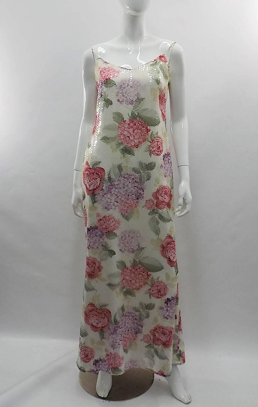 Perfect for summer garden or beach party!! Escada floral gown covered in clear sequins. Thin straps. Size 40 US 8
Bust 38-40