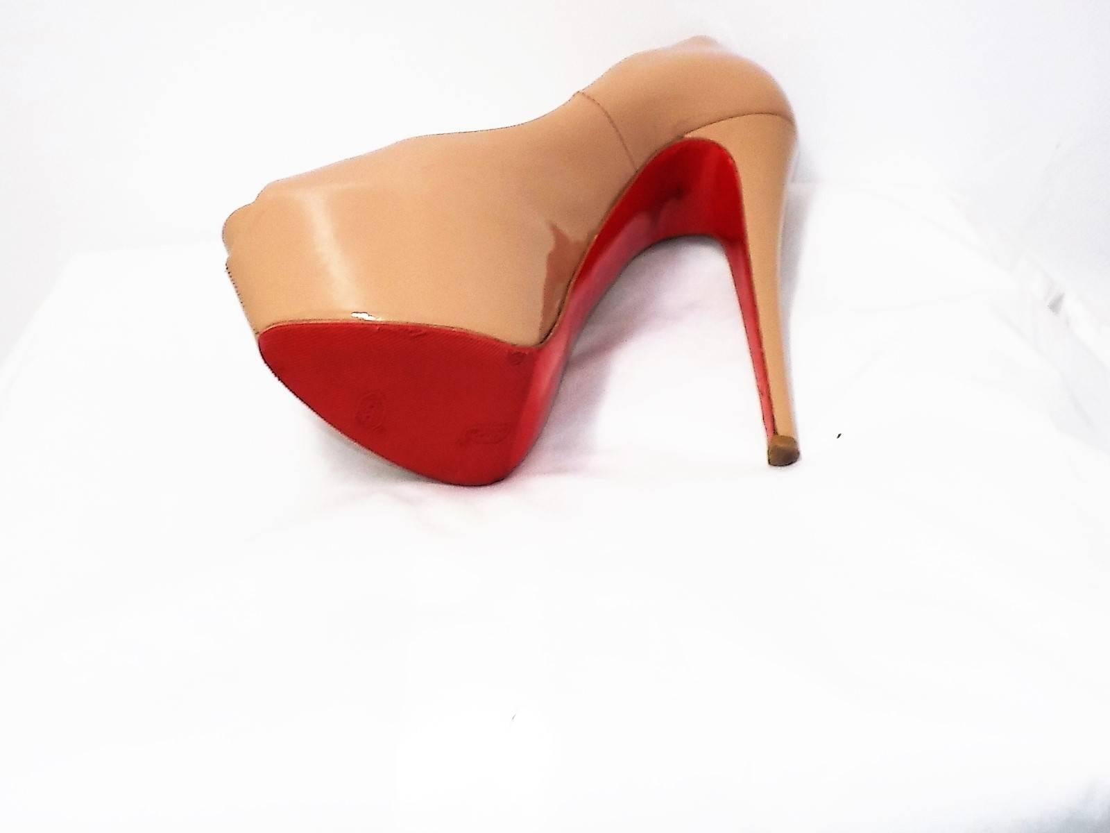 This is an authentic pair of CHRISTIAN LOUBOUTIN Patent Calf Highness 160 Peep Toe Platform Pumps 39 in Nude. These stunning pumps are crafted of glossy patent calfskin leather in beige. These feature a two inch covered platform and a 6.5 inches 