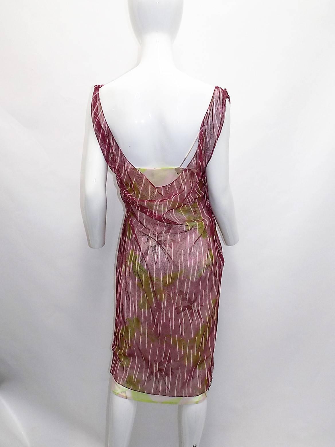 Never worn with tags still attached and original retail price of $3410.00 Gianni Versace Couture  beautiful double layered summer dress. Combination of two different prints in perfect harmony.  Nylon , cotton and spandex blend.Size 44
Bust 38 hips