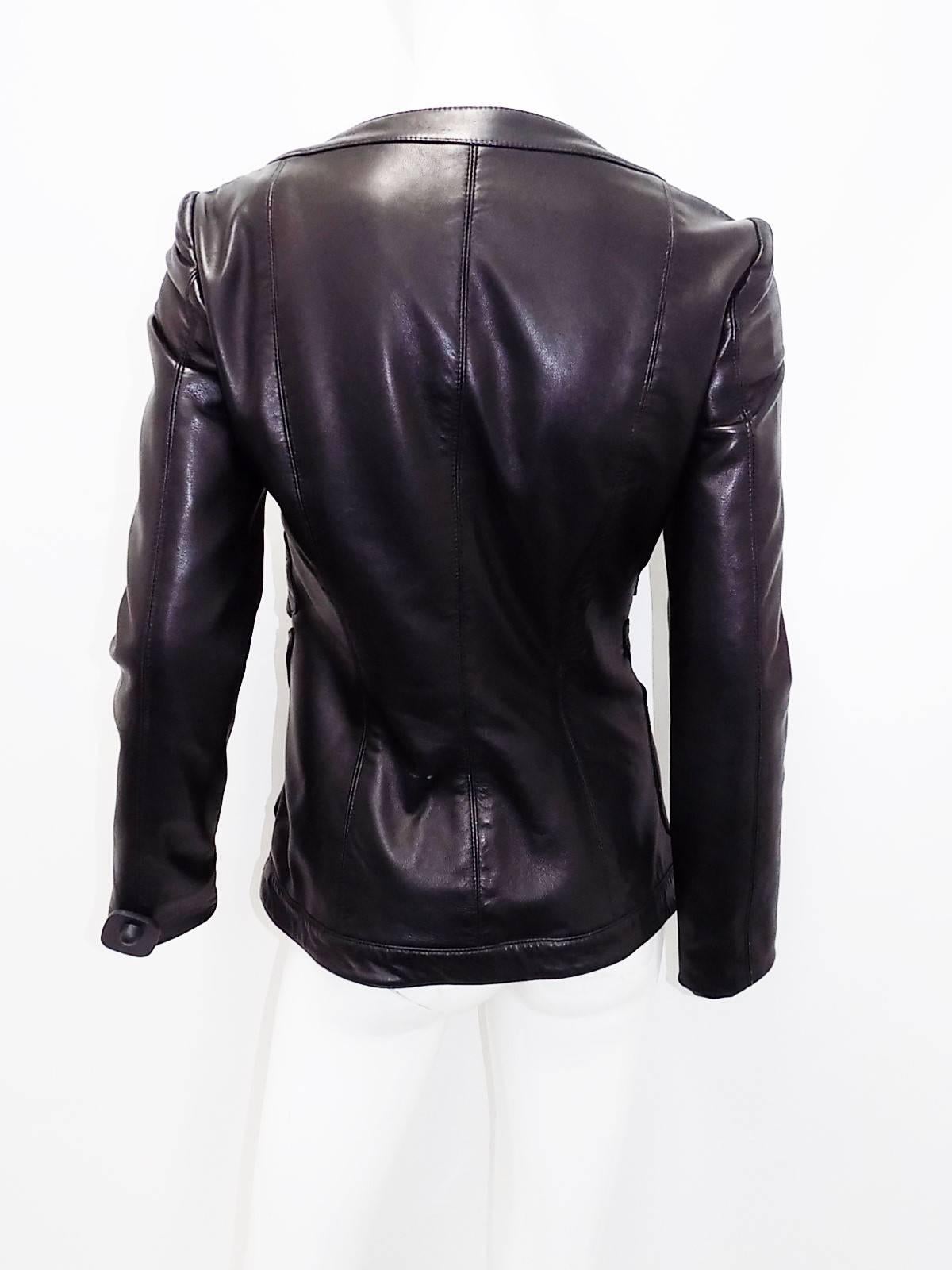 Gemma Kahng spectacular sexy Rare vintage Black Leather cutout  jacket zip front . Bird cage strips if leather with  appliques placed  over.  Buttery soft quality  leather.  Fully lined . Fabulous neckline. 
Pristine condition like new! Circa