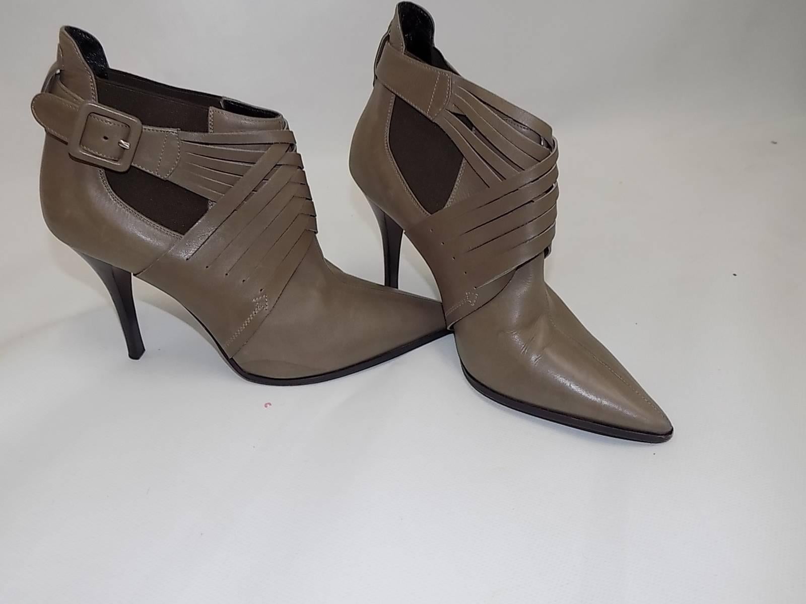 Fabulous grey Hermes booties. Cris  front detail, pointy toe cross , side buckle, elastic on both sides. 4 inch stacked heel. Worn once in  excellent condition. Size 37. Dust bag included