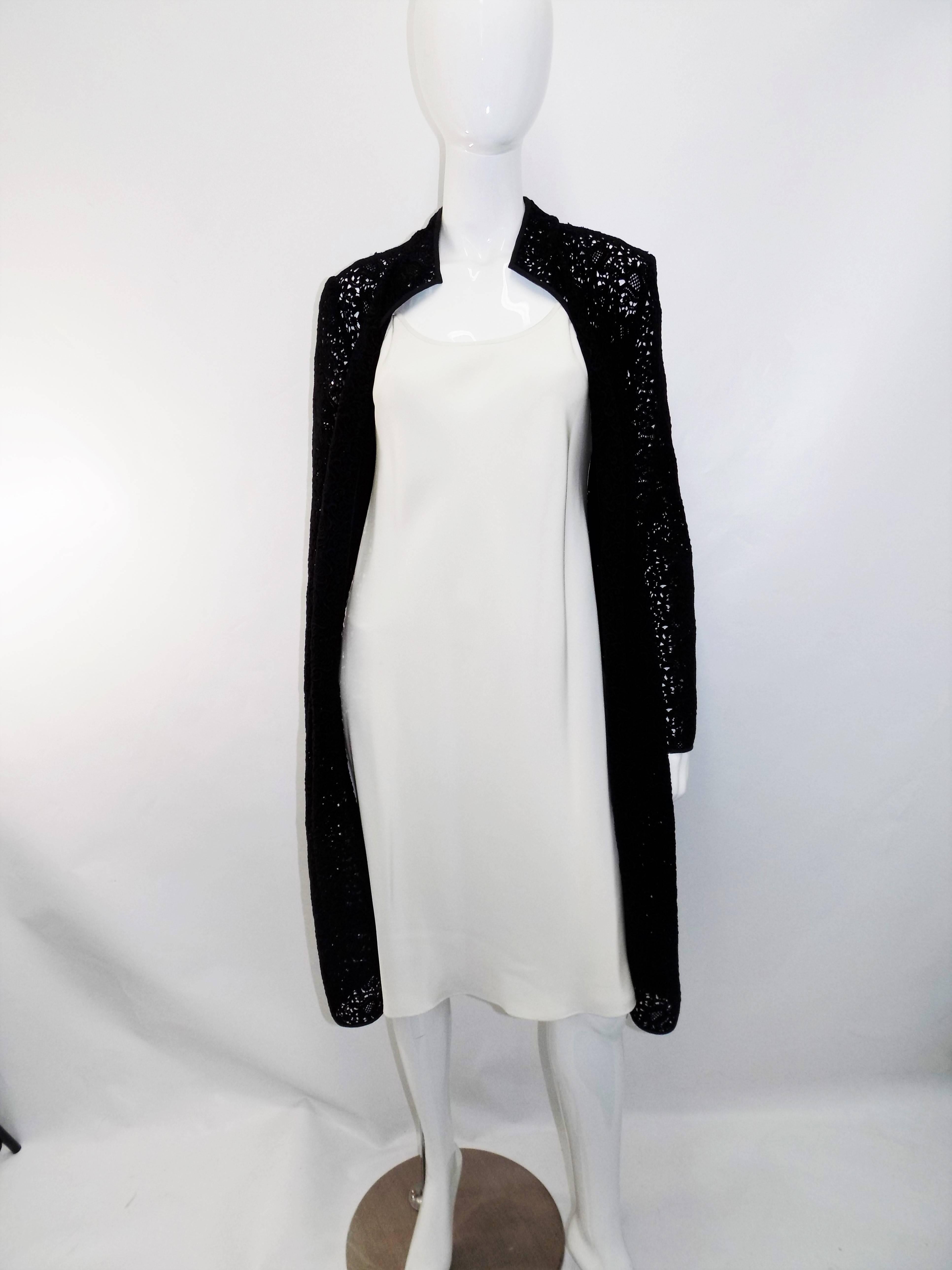 Stunning Oscar De La Renta  black lace Coat  over  ivory silk sheath dress. Pristine condition like new!!. Beautiful seamless cotton lace coat. Could be worn with just about everything that you have in your closet.  Simple ivory sheath dress under.