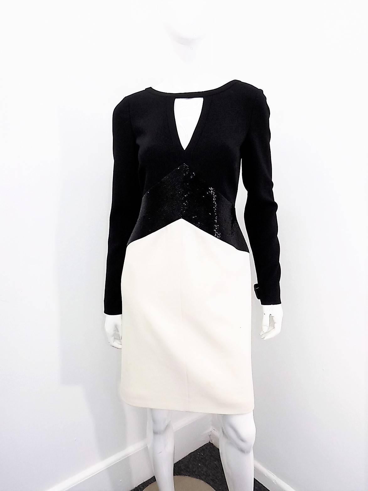 New and fabulous  Emilio Pucci White Bicolor Stretch Wool Dress . Black bugle beads waist line wide detail. Just stunning. Fully lined in silk. 98% wool and 2% elastine. 
Pristine condition. Like new.Size Italian 44 but very small . Will fit sz 6,