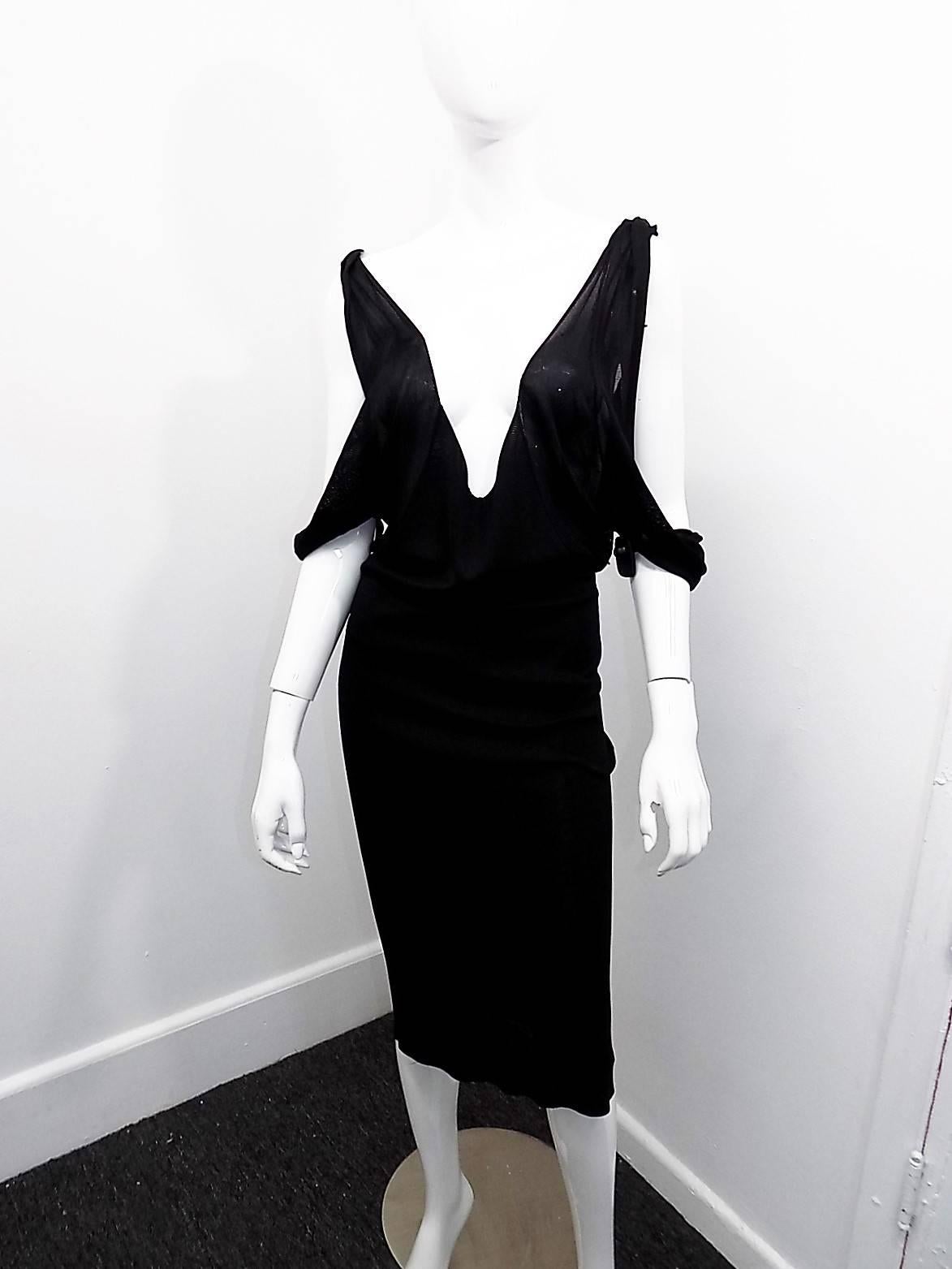 Very sexy and beautiful  Tom Ford For Gucci  Silky knit black dress. Rolled shoulder with open sleeves and deep plunging decolte and back. True stunner.Pristine condition. Size small 