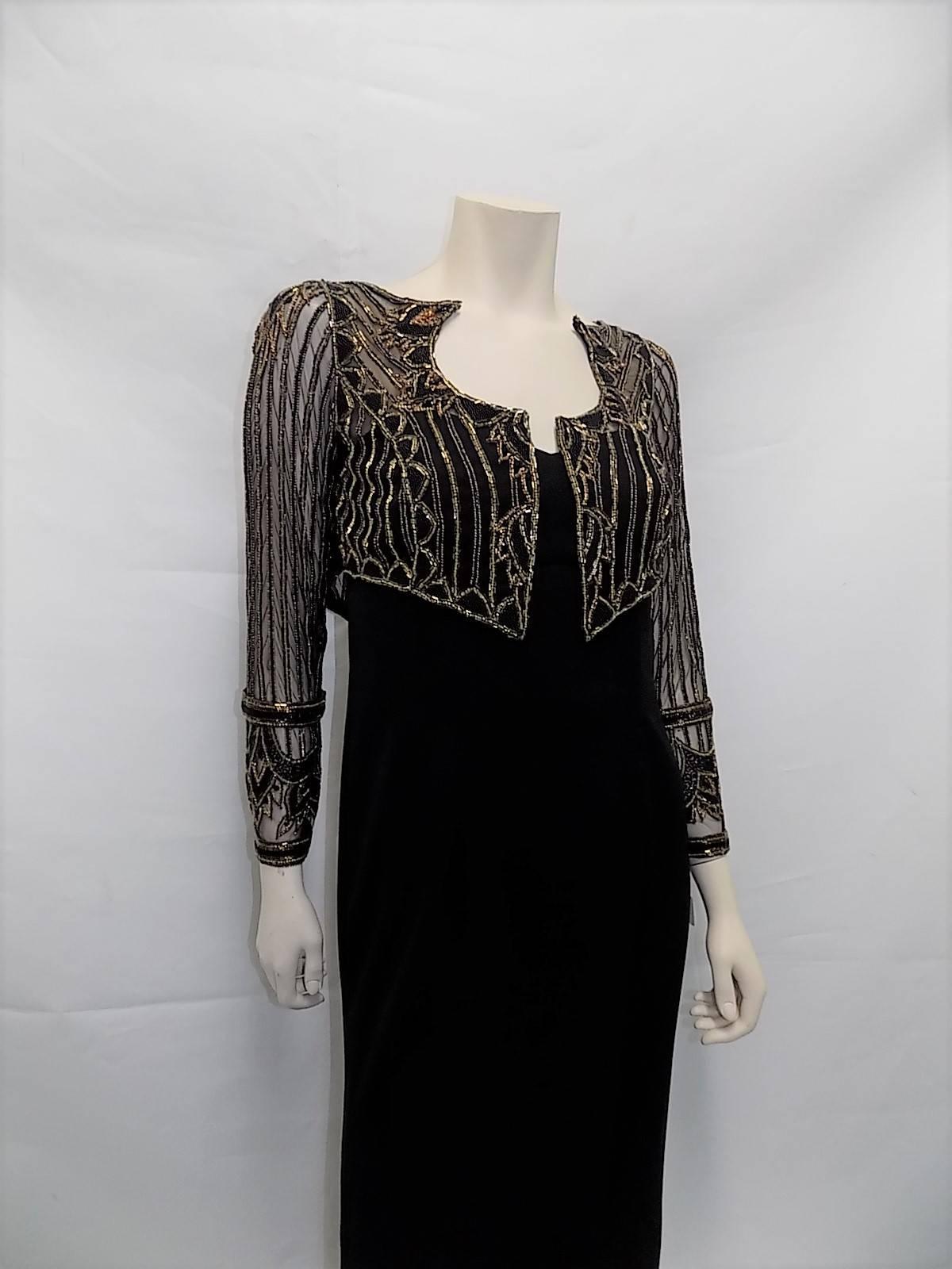 Fabulous black crepe Bob Mackie black Gown Wit Beaded illusion bolero. Jacket is actually attached to a dress. Gold and Black Bugle and caviar beads over mash. Fully boned corset. Size 6. bust 36
