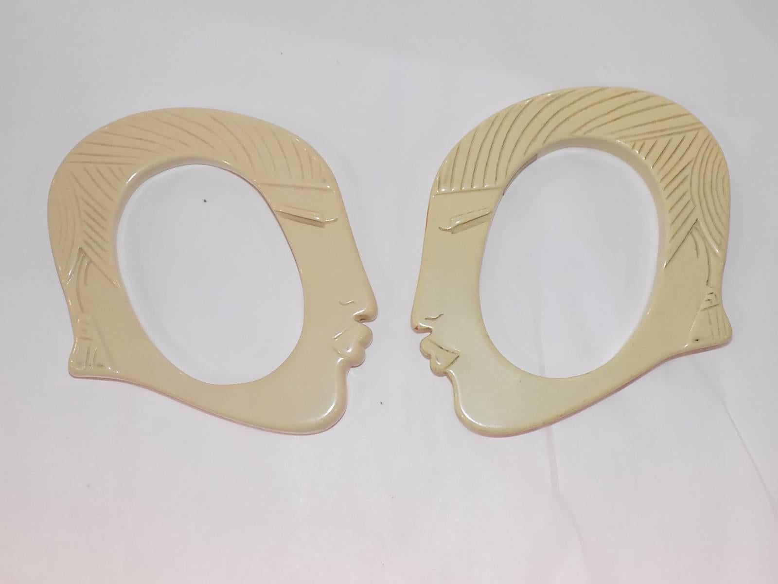 Rare and chunky Bill Schiffer face bangle set of two . This piece is modeled after Josephine Baker in ivory Resin. Hand carved. Signed by artist 