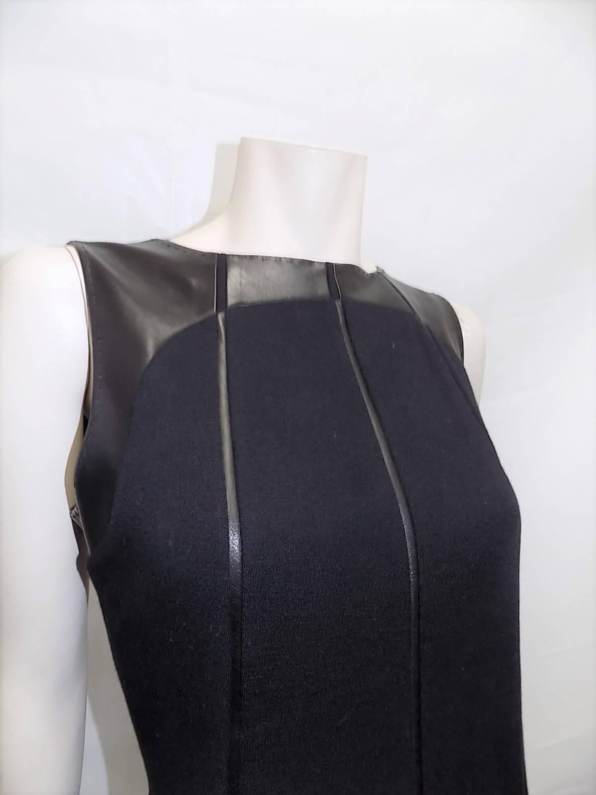 Beautiful Ralph Rucci Chado Black Wool  Jersey dress with Leather Inserts. Pristine condition . Silk Lined.  Sz 12
Bust 38