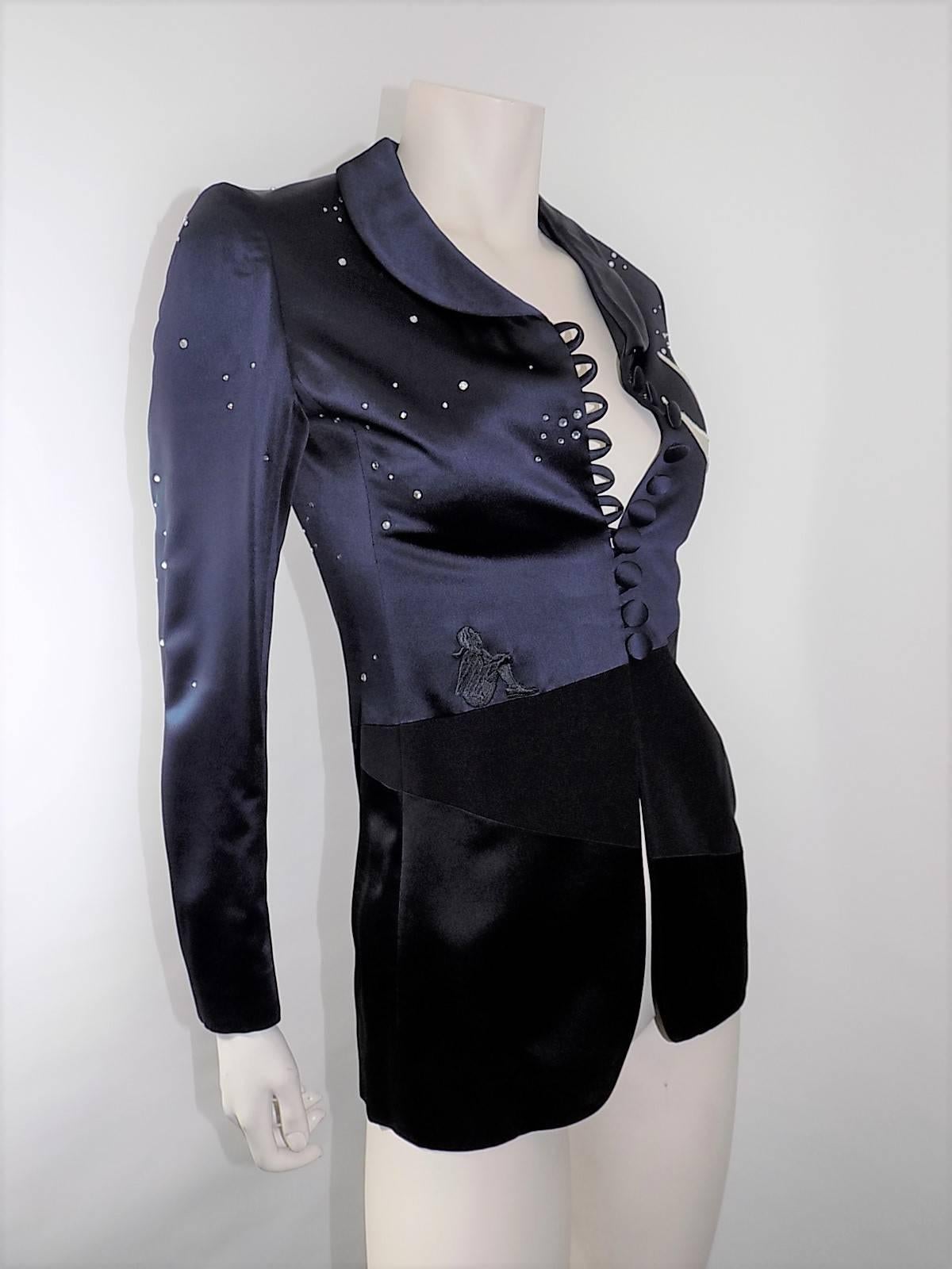 Never worn fabulous navy and black Moschino Cheap and Chic  Vintage Jacket.
Adorned with crystals representing stars/ Embroidered  small figure gazing at the sky. Blue sky print  lining. Loops and covered buttons front closure. 
Size Italian 40 us 6