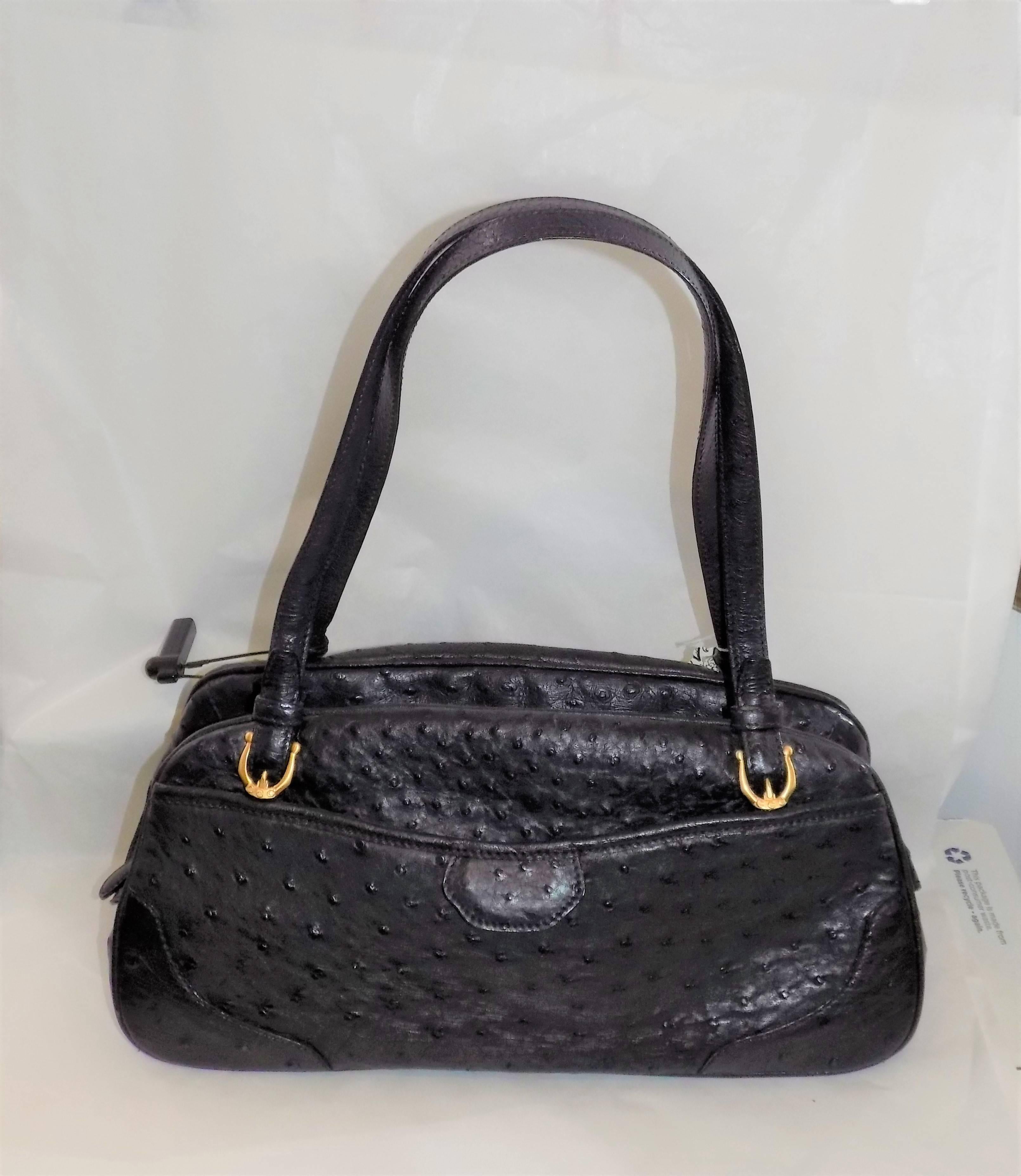 Absolutely gorgeous, amazing 14-1/2" x 7-3/4" x 6" full quill black  ostrich bag that you will love and adore.  There are two outside slip-in pockets with magnetic closure that will hold all the things you need to run around such as