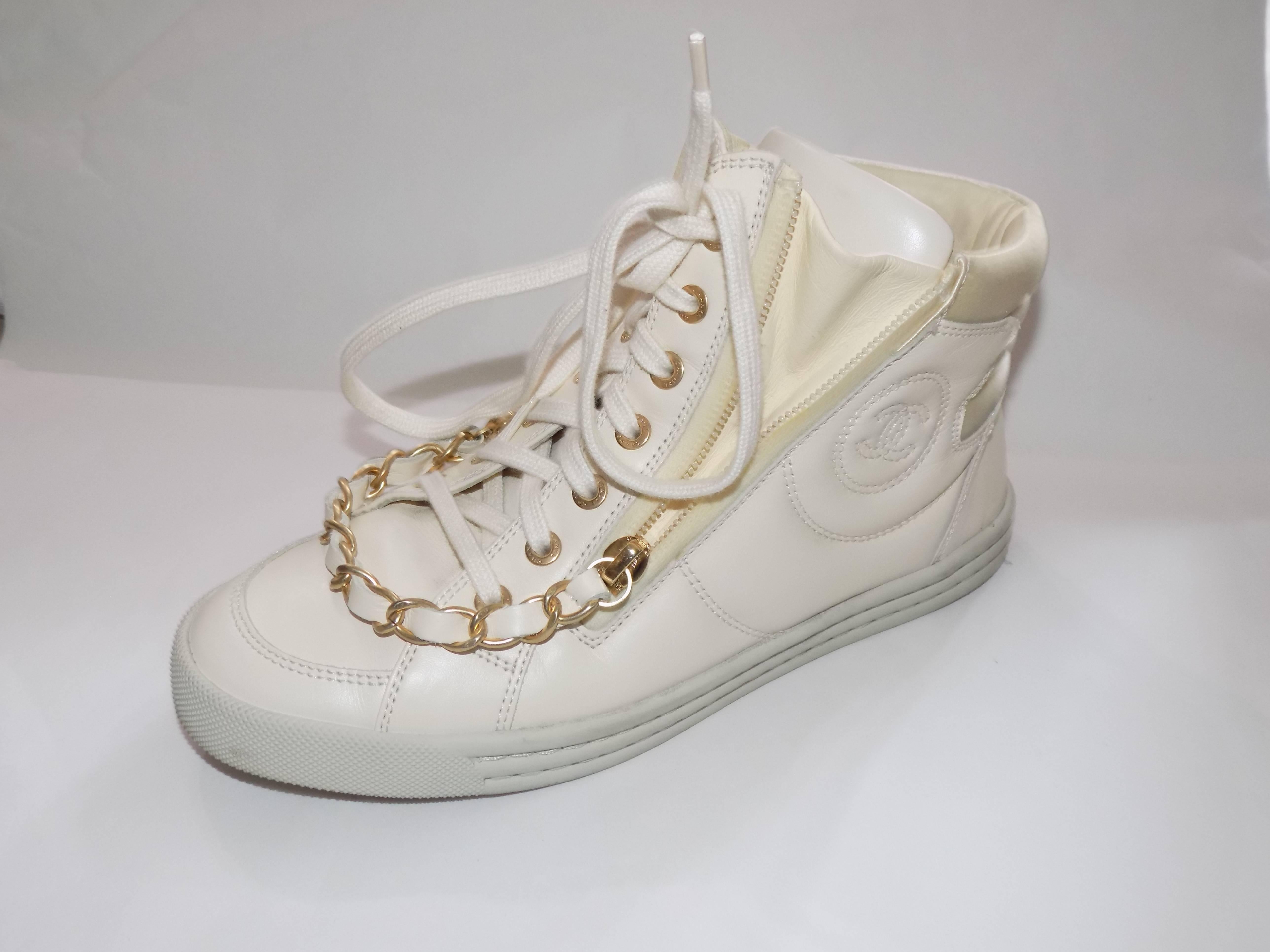 fabulous worn once Chanel winter white  sneakers with two side zippers ang gold pull chain.  CC logo  Size 37.5