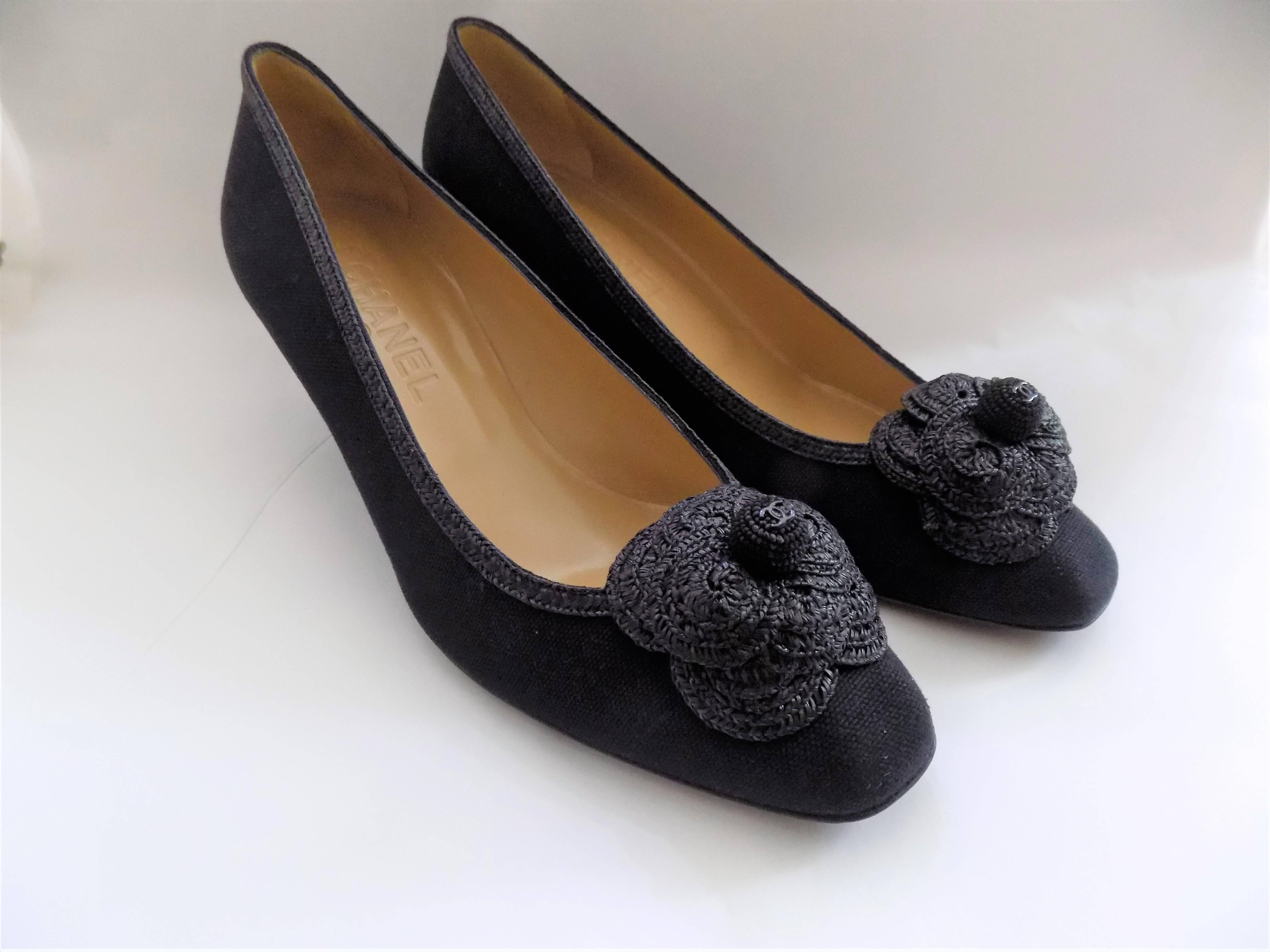 Beautiful summer cotton shoes with raffia lace camellia front and CC logo in the middle.Worn once. No signs of wear except very slight on the sole but barely visible. Size 38 1/2 Heel 2.5 inch