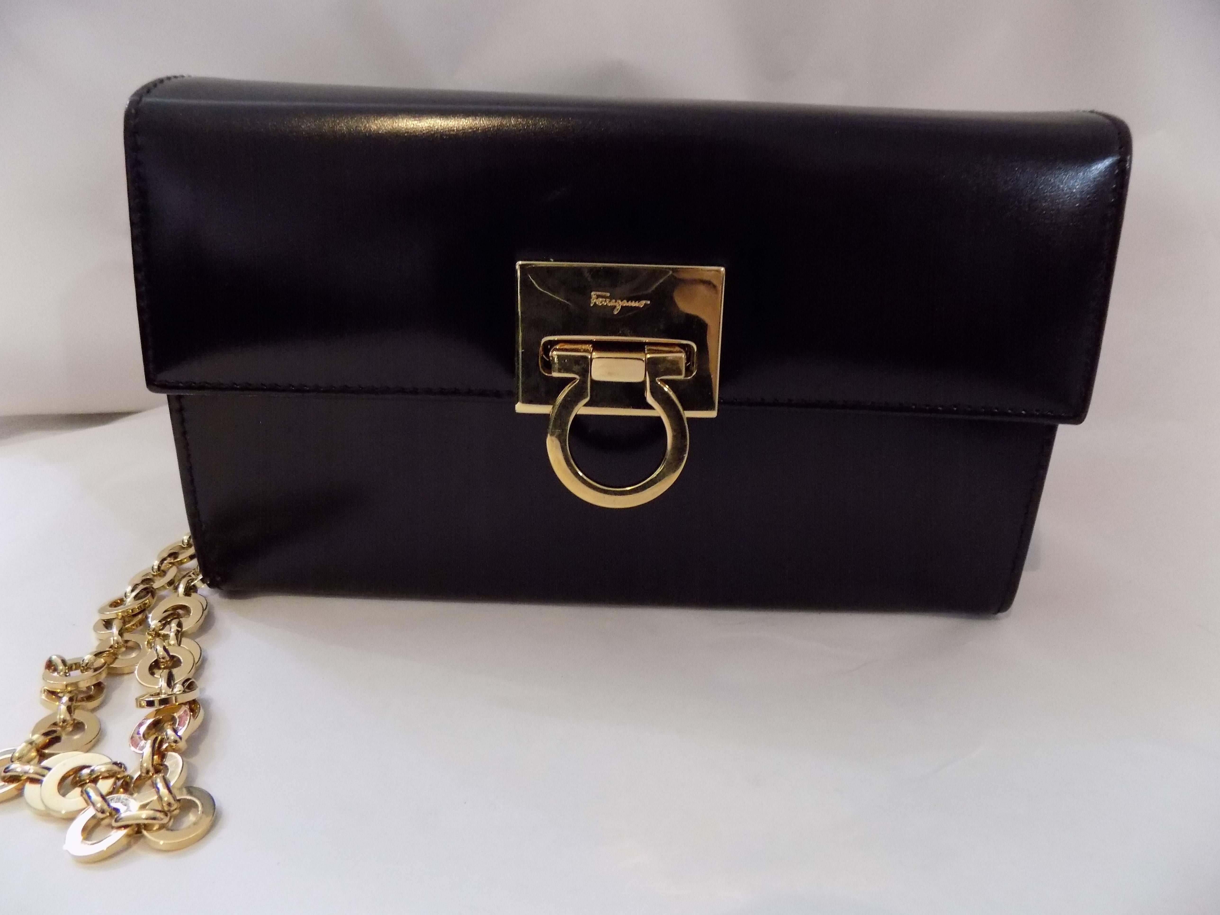  Salvatore Ferragamo black polished clutch / shoulder bag w gold chain In Excellent Condition In New York, NY