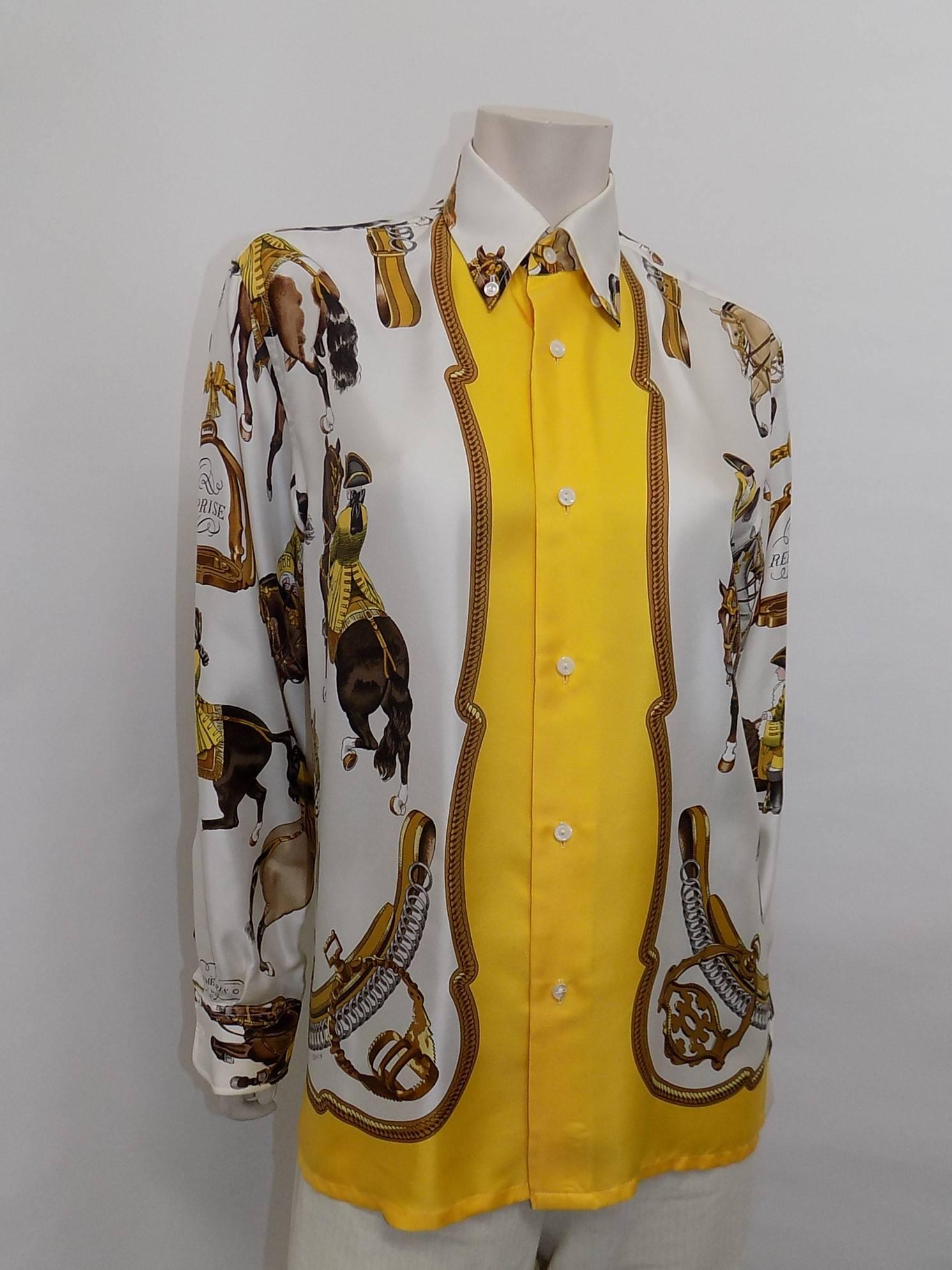 Pristine condition , like new. white with yellow , gold and brown  coloring Hermes vintage silk equestrian button down shirt blouse "Reprise".by  foulard  ledoux
Size 40. Men's button side but it could be worn by woman.
Bust 44