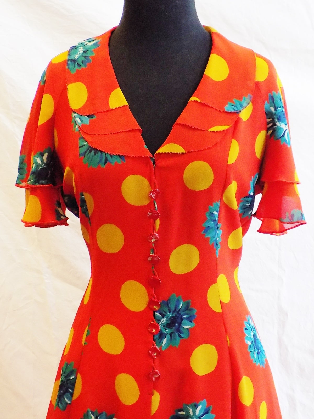 Beautiful Emanuel Ungaro vintage silk romantic  chiffon floral dress . Pristine condition like new. Dress features enamel painted front button closure. Cascading layers of soft flowing chiffon skirt, sleeves and collar design. . Very romantic print