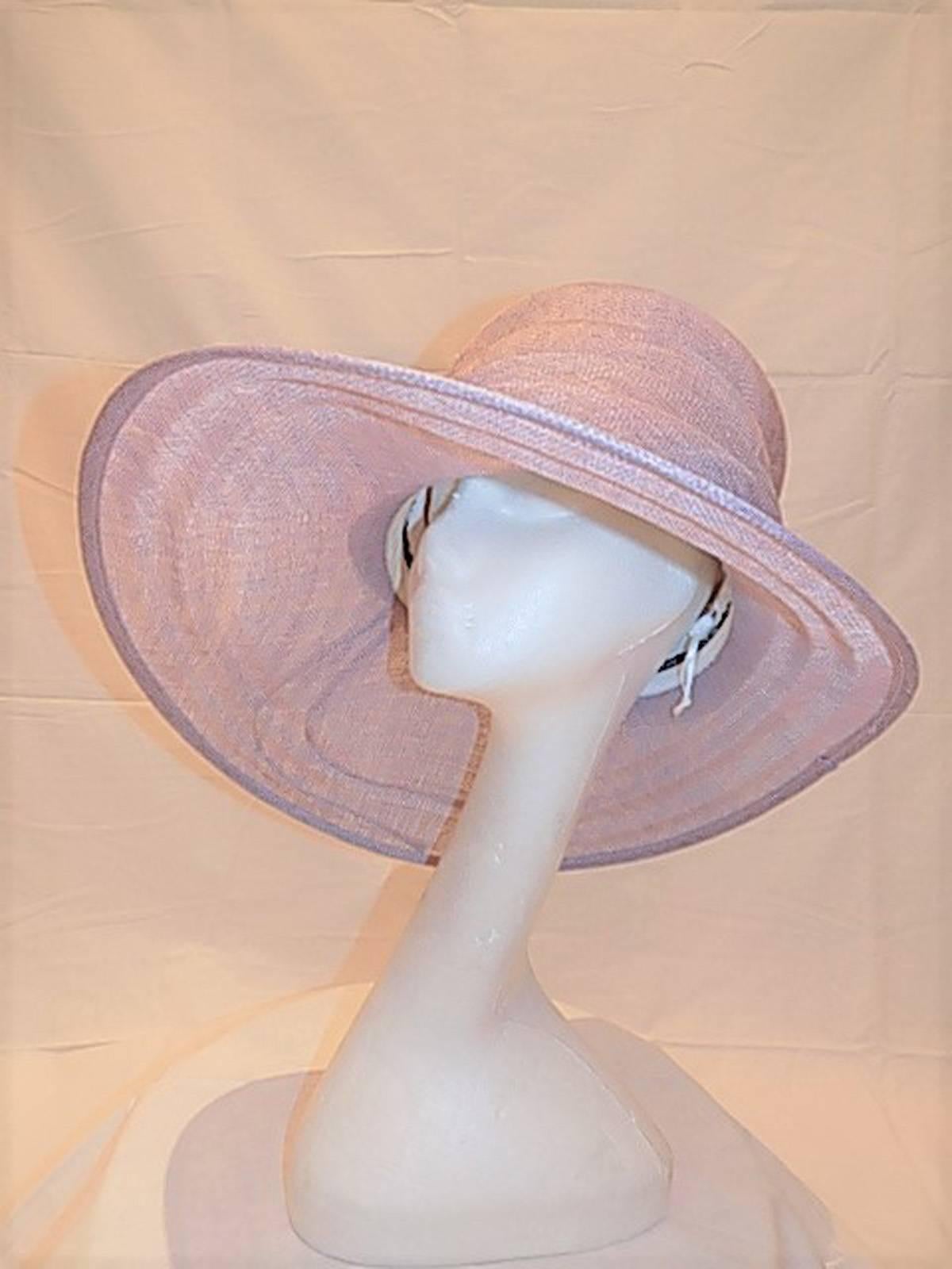 Incredible millinery work. asymmetrical brim with spectacular folds.  High top. Just gorgeous. New 