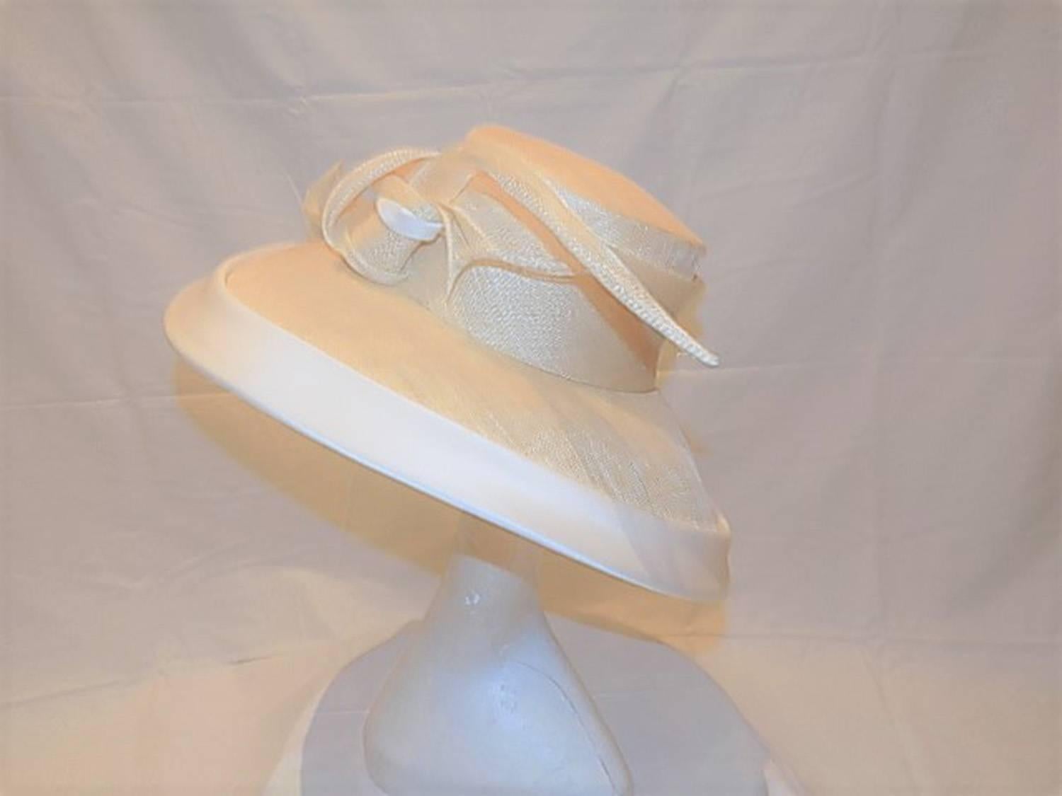 Royals  most favorite hat designer. This is her new never worn spectacular summer wide brim hat with silk trim and signature twirl. Retailed close to $2000. 
The Duchess of Cambridge debuted beret  from Sylvia Fletcher from royal milliner James Lock