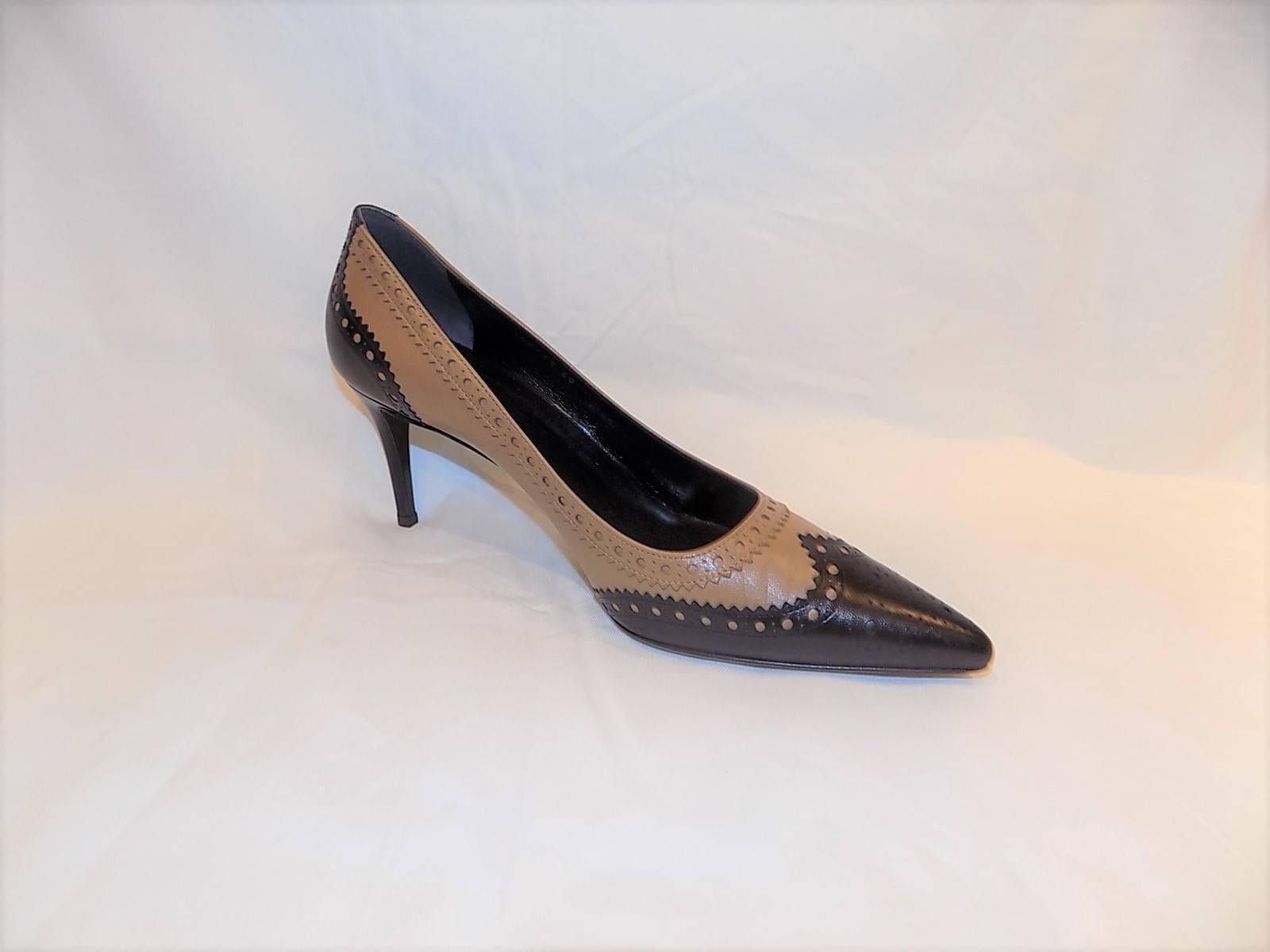Fabulous Gucci New pointy toe spectator pump. Lite brown and black leather. Slim 3