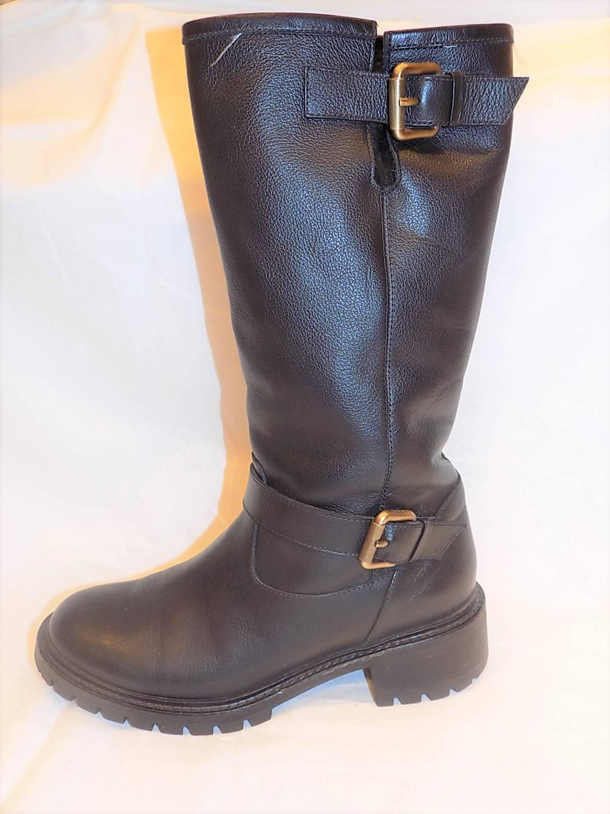 
worn once in pristine condition. Shipped in Original Box. Retail Price $1000 Plush, cozy rabbit fur lines a stylish leather motorcycle boot detailed with buckled straps at the top and base of the shaft. A lugged rubber sole adds a tough finish to