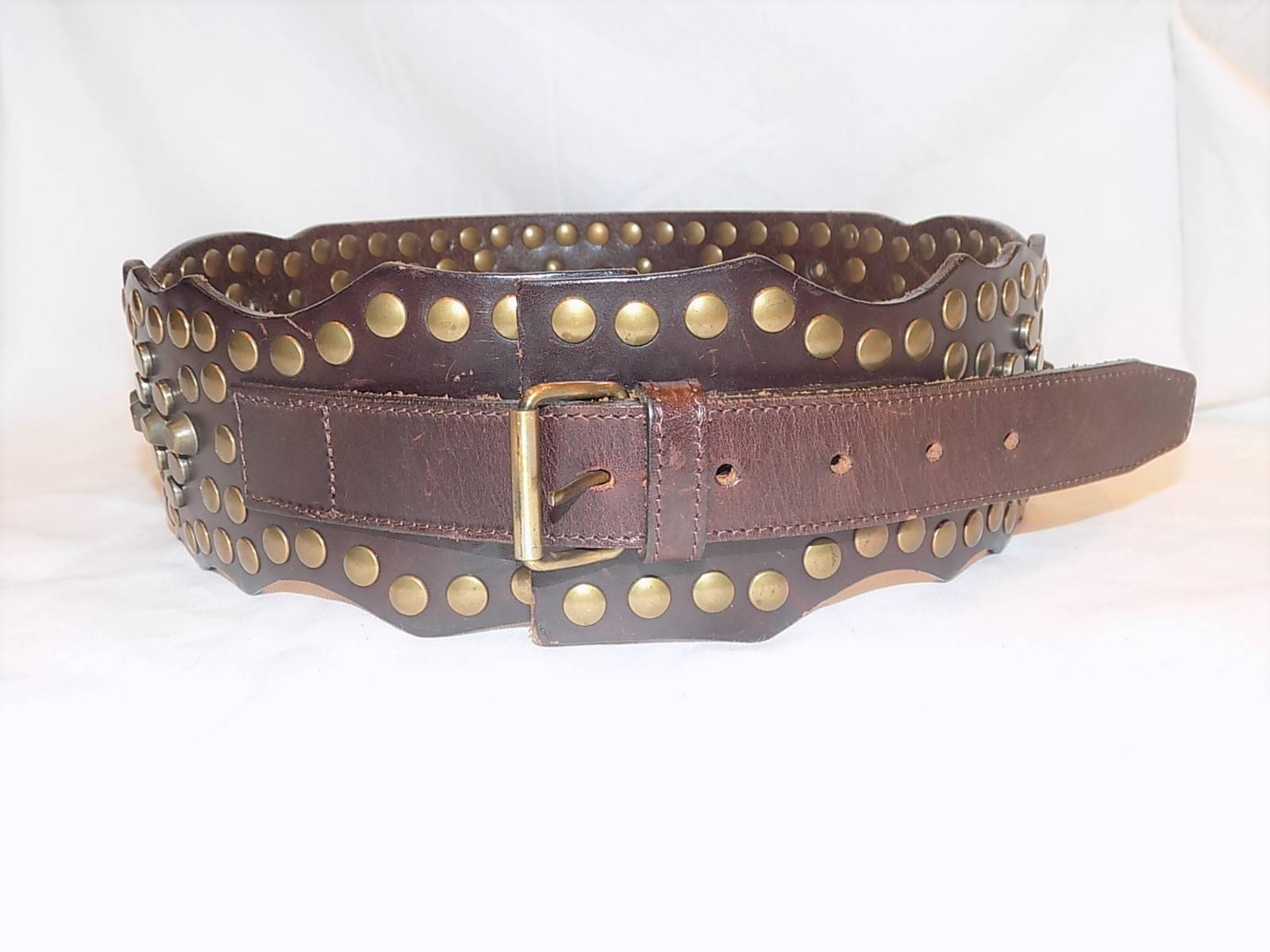 Obsessed with fabulous belts. This is a must have Dolce & Gabbana heavy metal studded wide leather belt/  Brass and silver grommets and studs on a thick brown leather, Just Fabulous! From 28