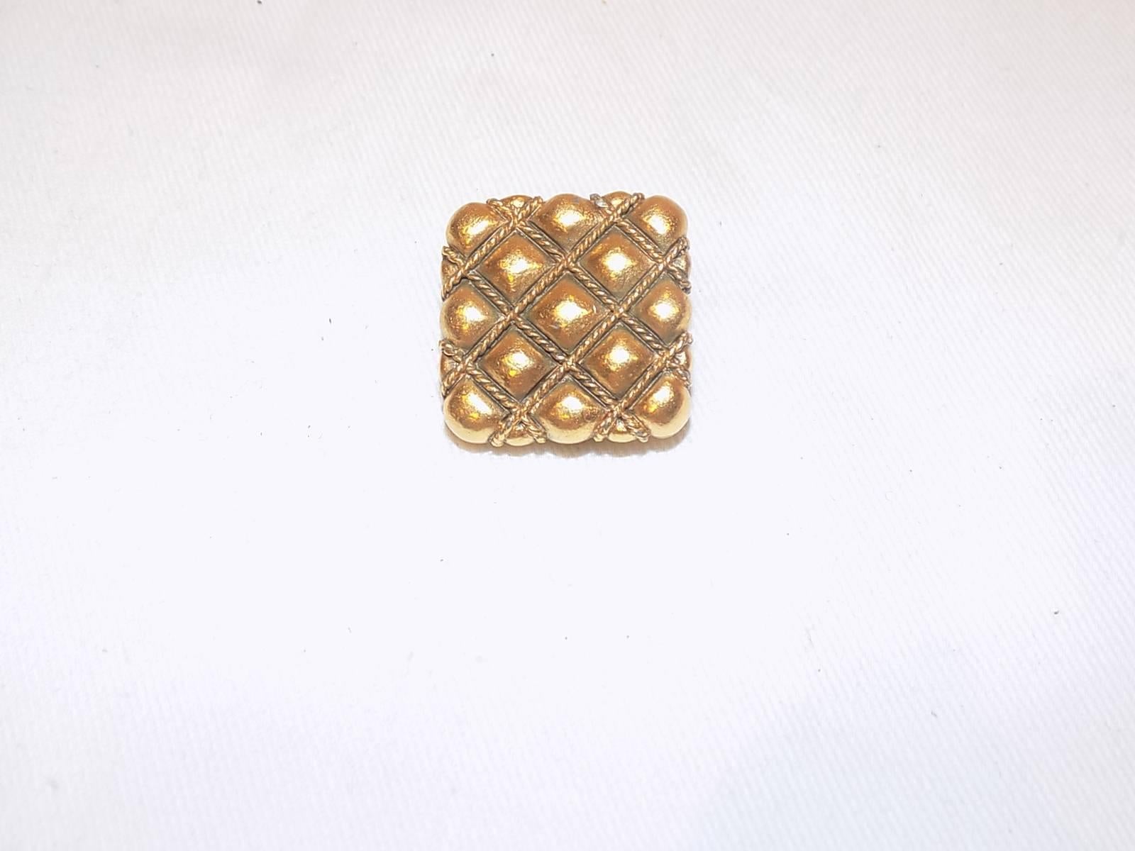 Gorgeous gold tone  with so perfectly executed details. Clip on, signed. 
1