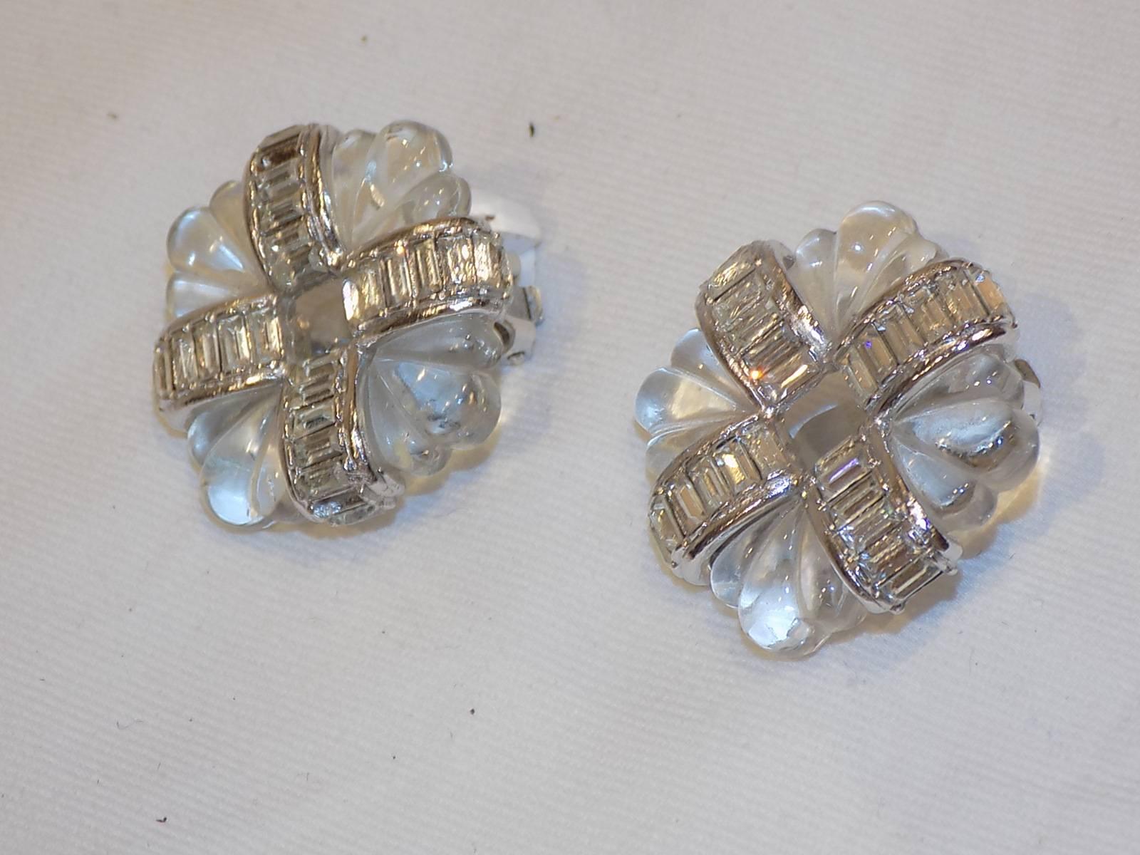 Spectacular Kenneth J Lane vintage Carved crystal earrings. Sqaure with hole in the middle . Decorated with CZ baguettes . Absolutely stunning! Clip On! 
1 1/4 