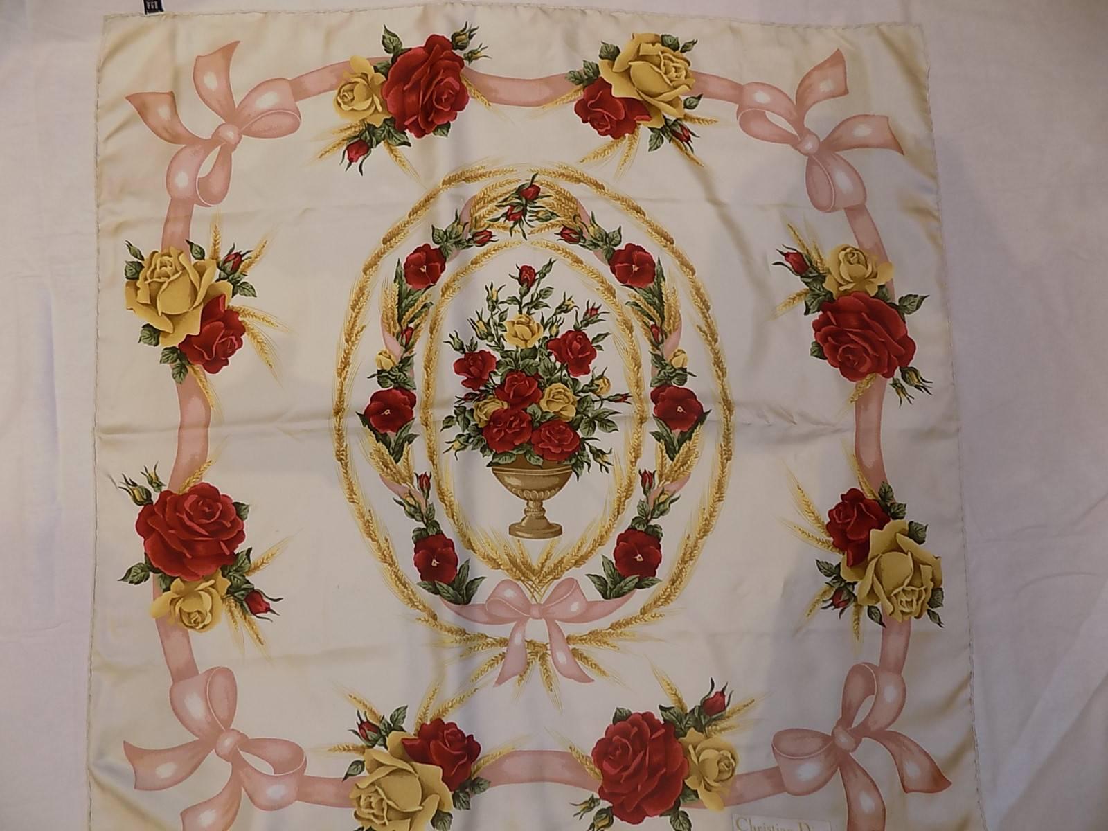 Beautiful Christian Dior Vintage silk floral scarf with pink ribbon and bow. Mint condition . Hand rolled edges.  35 by 35 Pink ,gold and deep red major colors